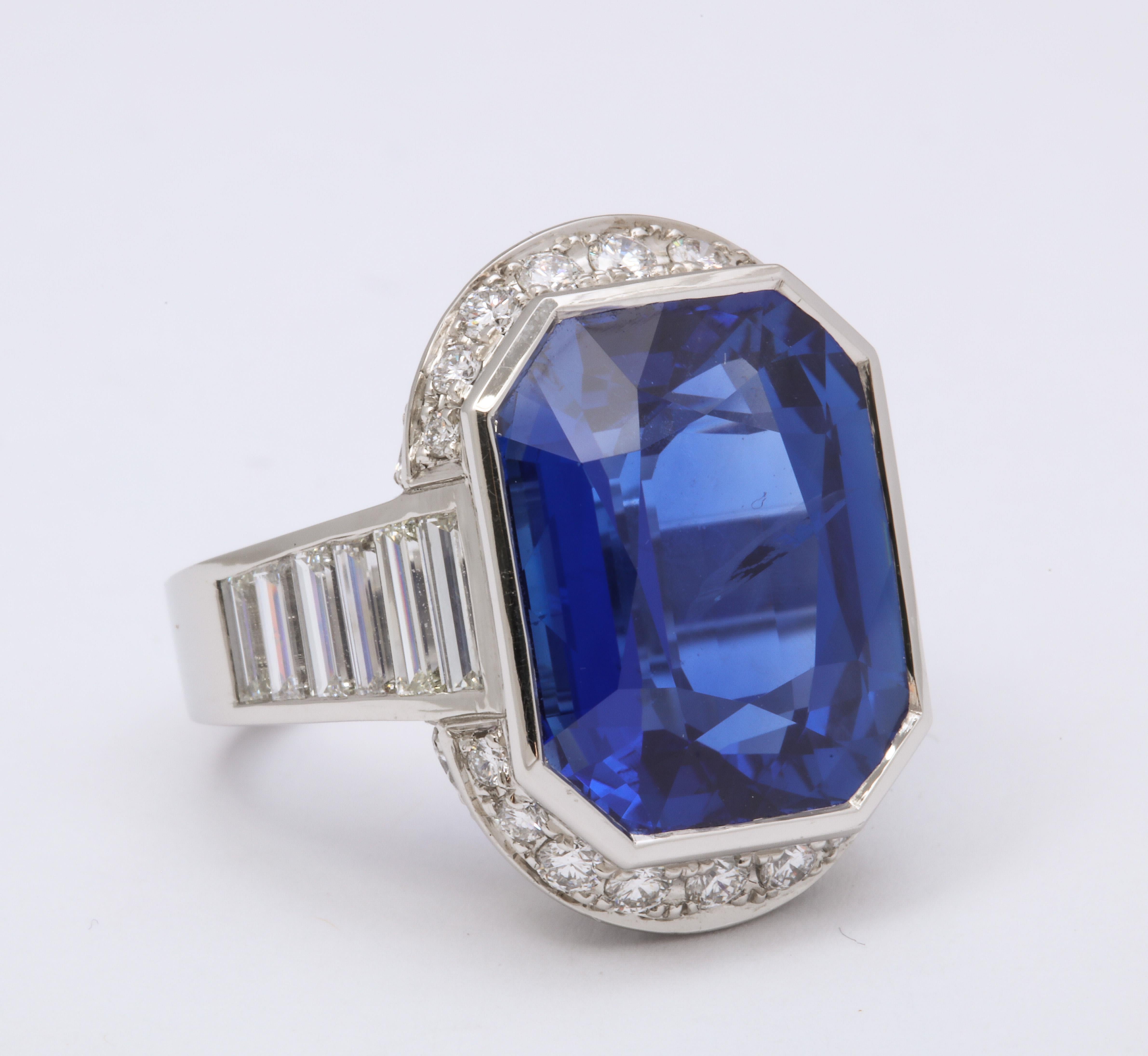 Ceylon Sapphire and diamond ring. Platinum, 19.6 grams. Octagonal cut sapphires @ 18.46 cts tw.  48 full cut and baguette diamonds @ 6.60 cts tw.  1 1/4 