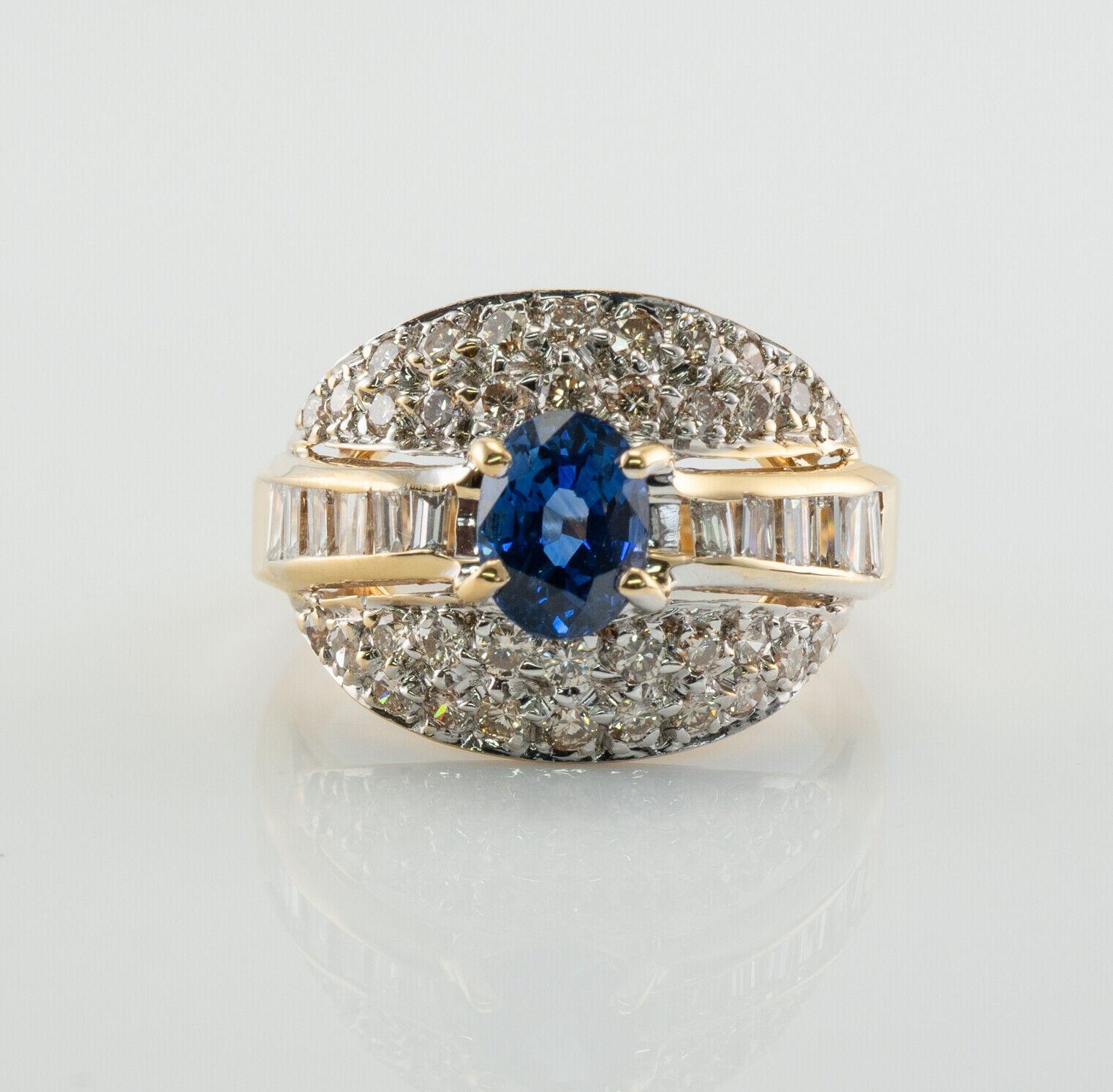 This beautiful estate ring is finely crafted in solid 18K Yellow Gold and set with genuine Earth mined Ceylon Sapphire and diamonds. There is a G.C & G hallmark inside of the shank. The center oval cut Sapphire measures 6mm x 4mm (.60 carat) and