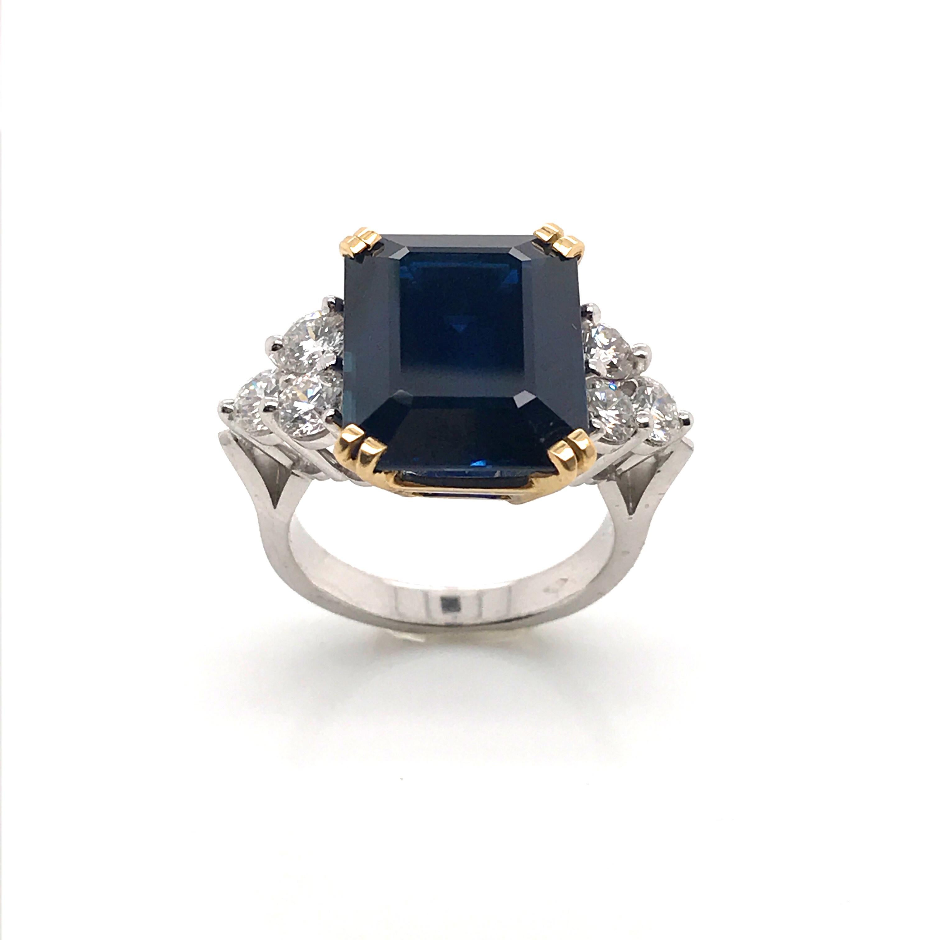 Ceylon Sapphire Diamonds Emerald size White and Yellow Gold Ring.
Ceylon Sapphire Form Emerald 14,35 Carat
6 White Diamonds 1,62 Carat Color F/G
White Gold 18 Carat
Yellow Gold 18 Carat