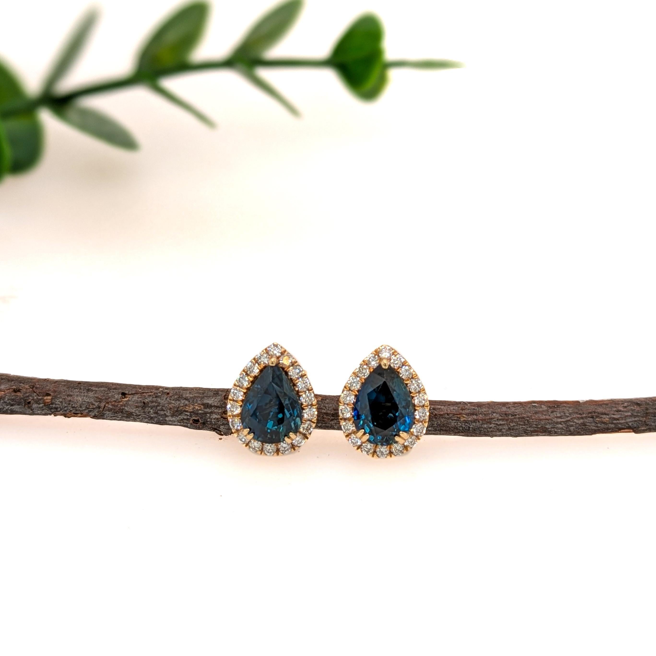 These pear-shaped blue sapphire earrings are bold, brilliant, and anything but basic—each deep blue gem is framed in a sparkling halo of earth-mined diamonds and set in solid 14k yellow gold, with secure butterfly backs for easy, all-day elegance.