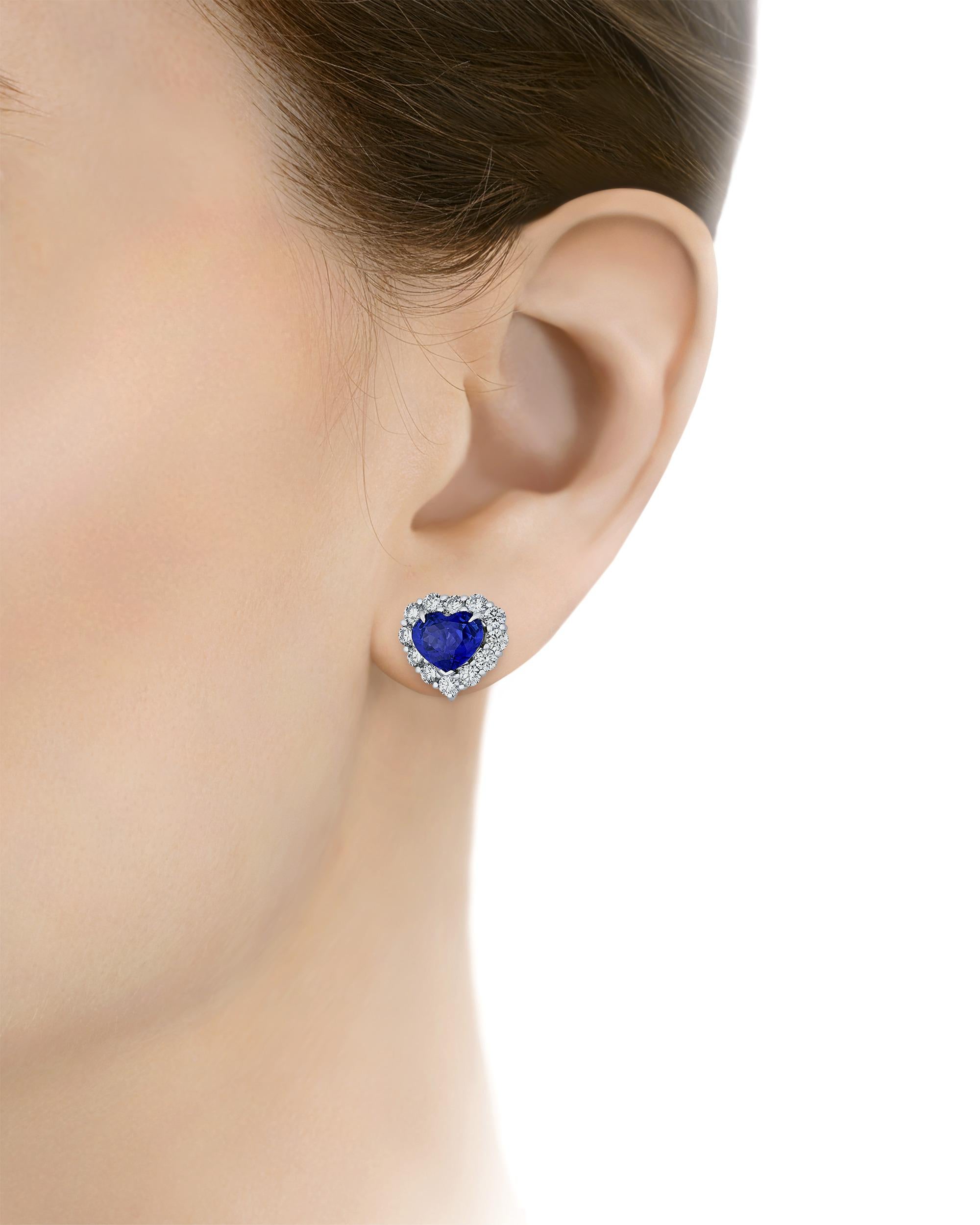 Two impressive heart-shaped Ceylon sapphires totaling 6.11 carats are set in these glamorous earrings. Displaying the vivid 
