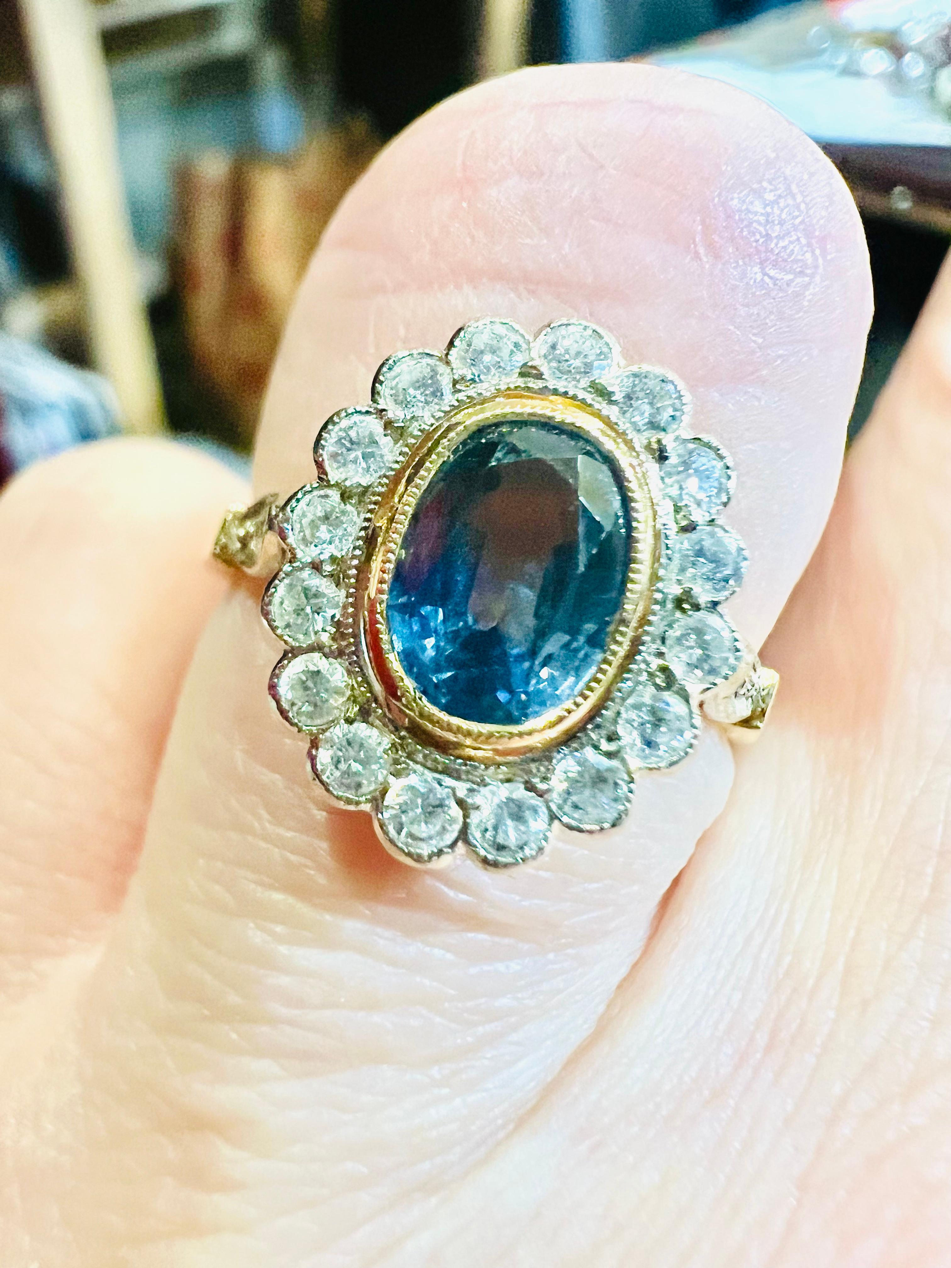 Women's Ceylon sapphire ring, surrounded by diamonds in 18 carat yellow gold