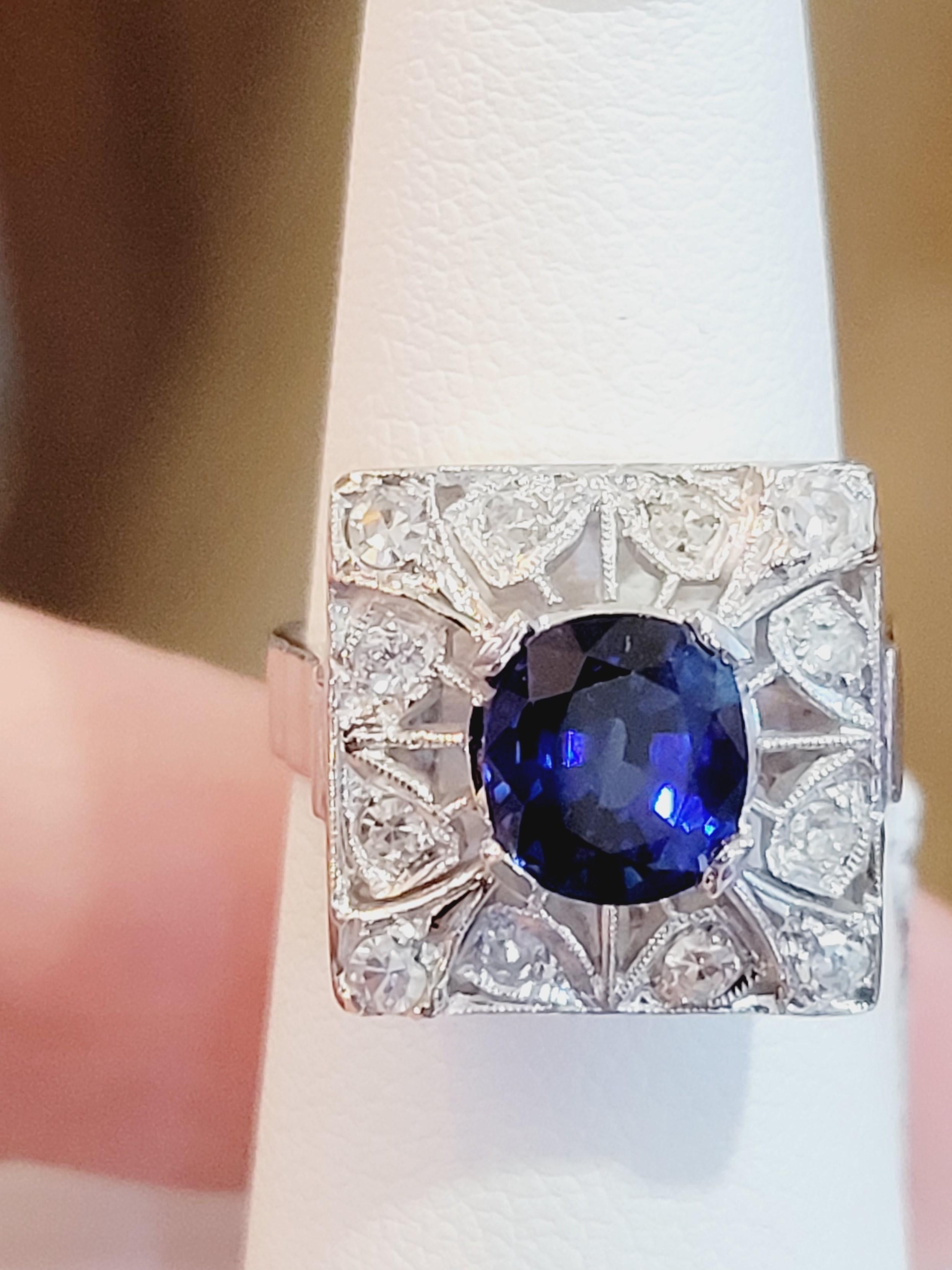 Art Deco Style Sapphire and Diamond Ring. Natural Ceylon Vivid Blue Sapphire 1.80carats. Cushion. Measurements: 7.44 x 6.70.
Diamond Weight: 0.50 carats. Old Mine cut. Metal: Platinum. 8.60 grams total weight. Size 5.5 Retail Price $16000
