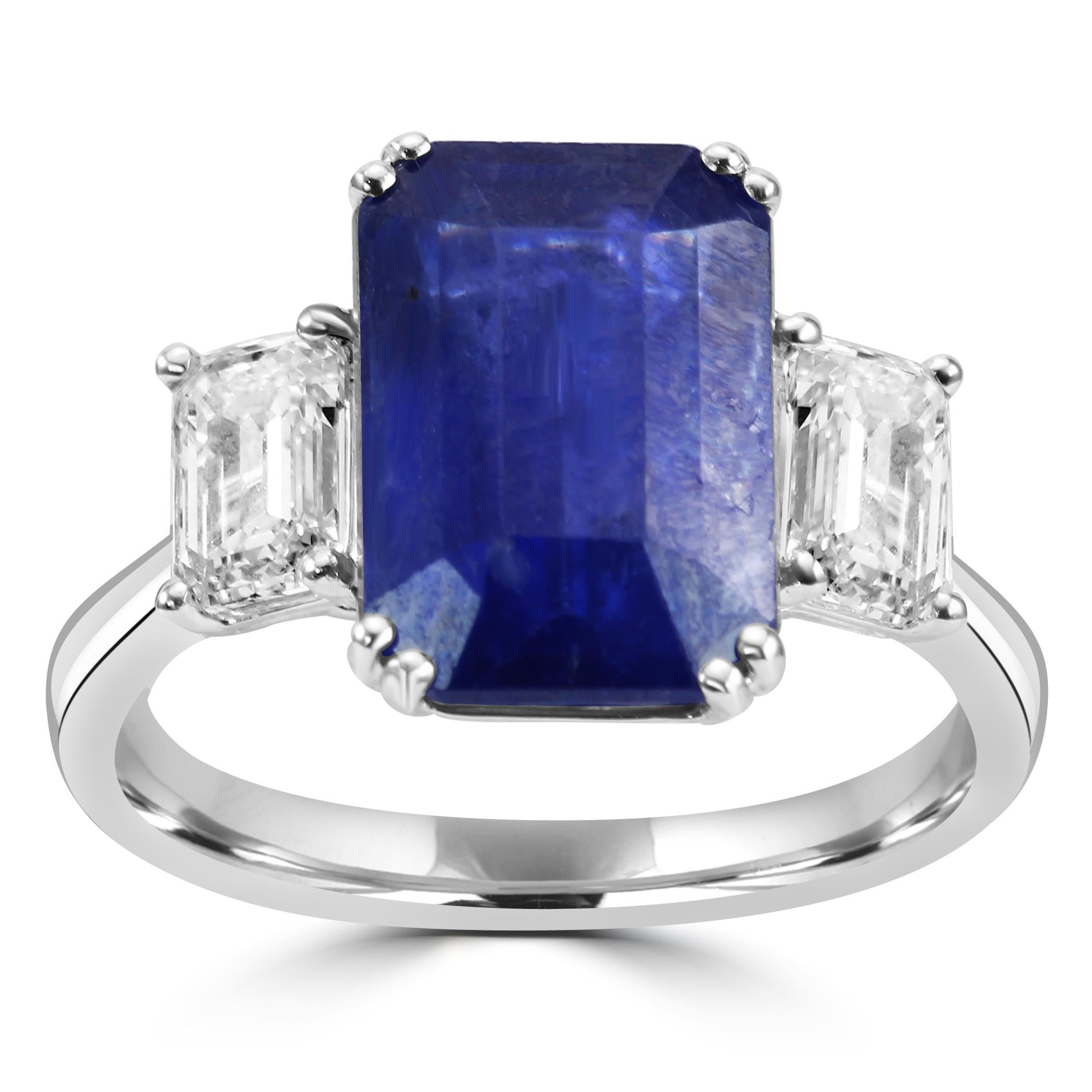 Behold our breathtaking Three-Stone Bridal Ring, a true symbol of everlasting love and sophistication.

At the heart of this exquisite ring is a stunning Ceylon Sapphire, featuring an elegant Emerald cut and weighing an impressive 6.62 carats. The