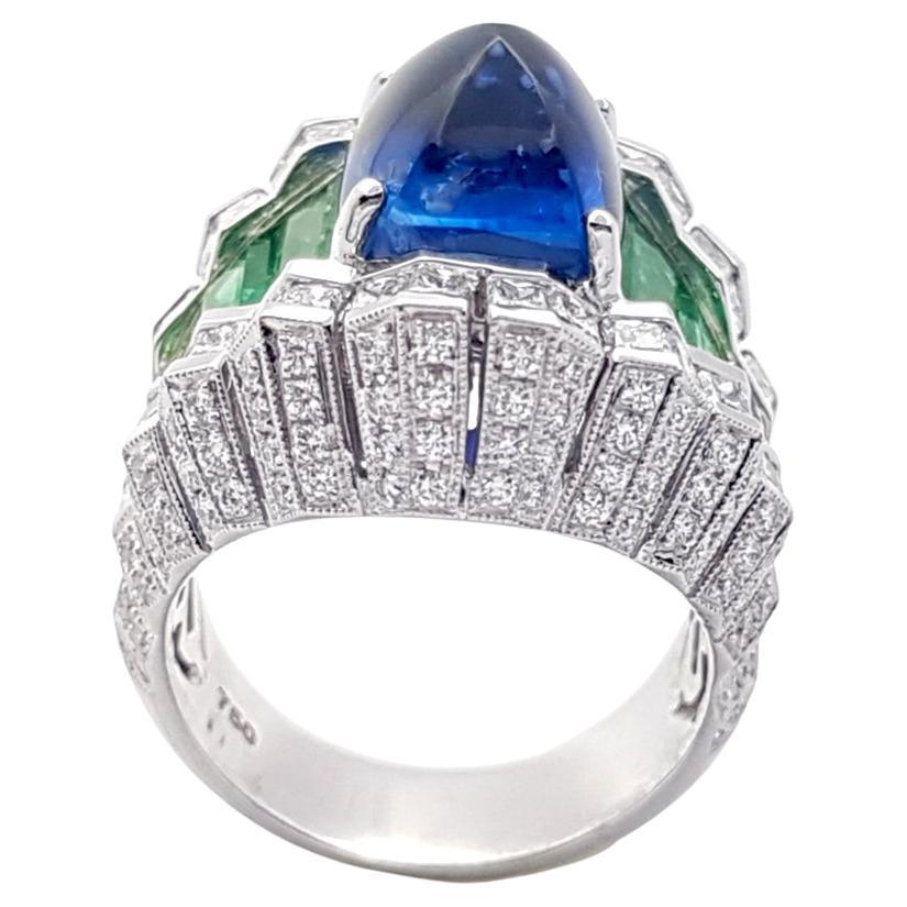 Ceylon Sugarloaf Blue Sapphire 9.41 carats, Emerald 2.93 carats and Diamond 2.99 carats Ring set in 18K White Gold Settings 

Width:  2.0 cm 
Length: 2.3 cm
Ring Size: 56
Total Weight: 19.99 grams

