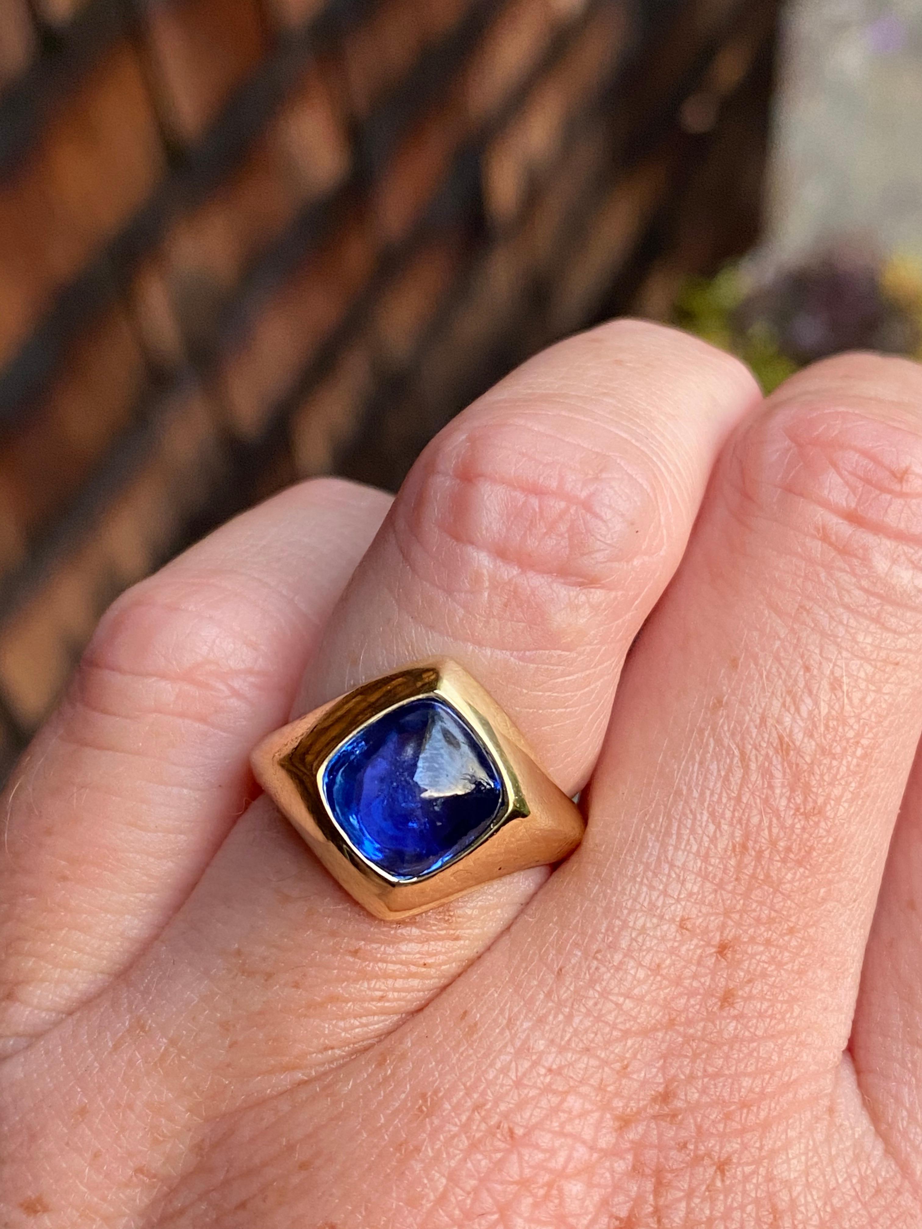 This ring features an extraordinary Ceylon sugar loaf cabochon sapphire in our hand carved wax/cast signet setting of 18 karat recycled gold. His or hers.
-4.16 carat certified natural no heat Ceylon sugarloaf sapphire emerald; luminous and full of