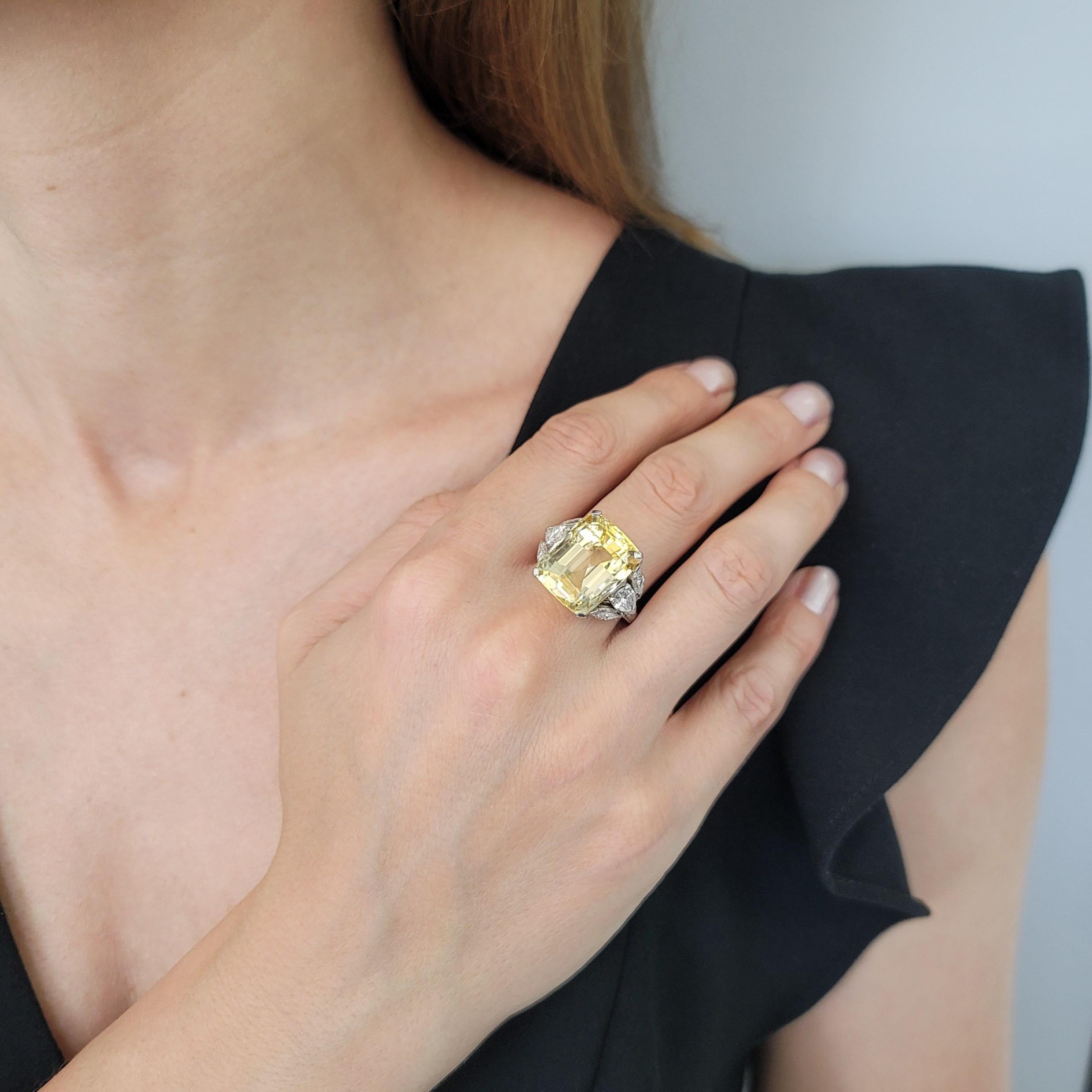 Impressive! Ceylon – No Heat Yellow Sapphire and Diamond Ring In Platinum. Center of this impressive ring is set with 24.73carats
cushion shaped yellow sapphire, GIA Report # 2239206602, dated
March 6, 2024, stating Natural Corundum, Yellow,