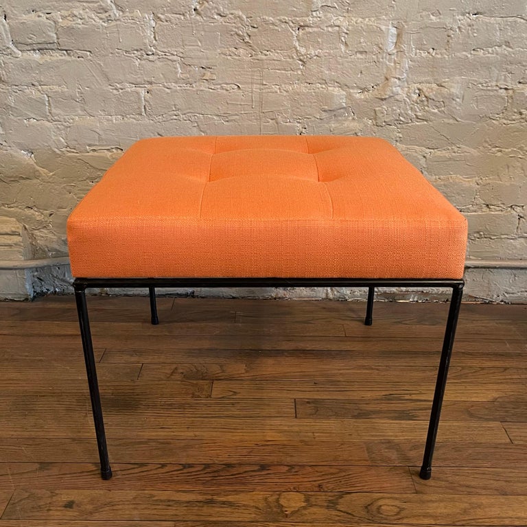 cFsignature, Mid-Century Modern style, ottoman features a minimal wrought iron frame with upholstered seat. Ottoman shown is in tangerine cotton linen. Also available in leather. Can be made with COM.