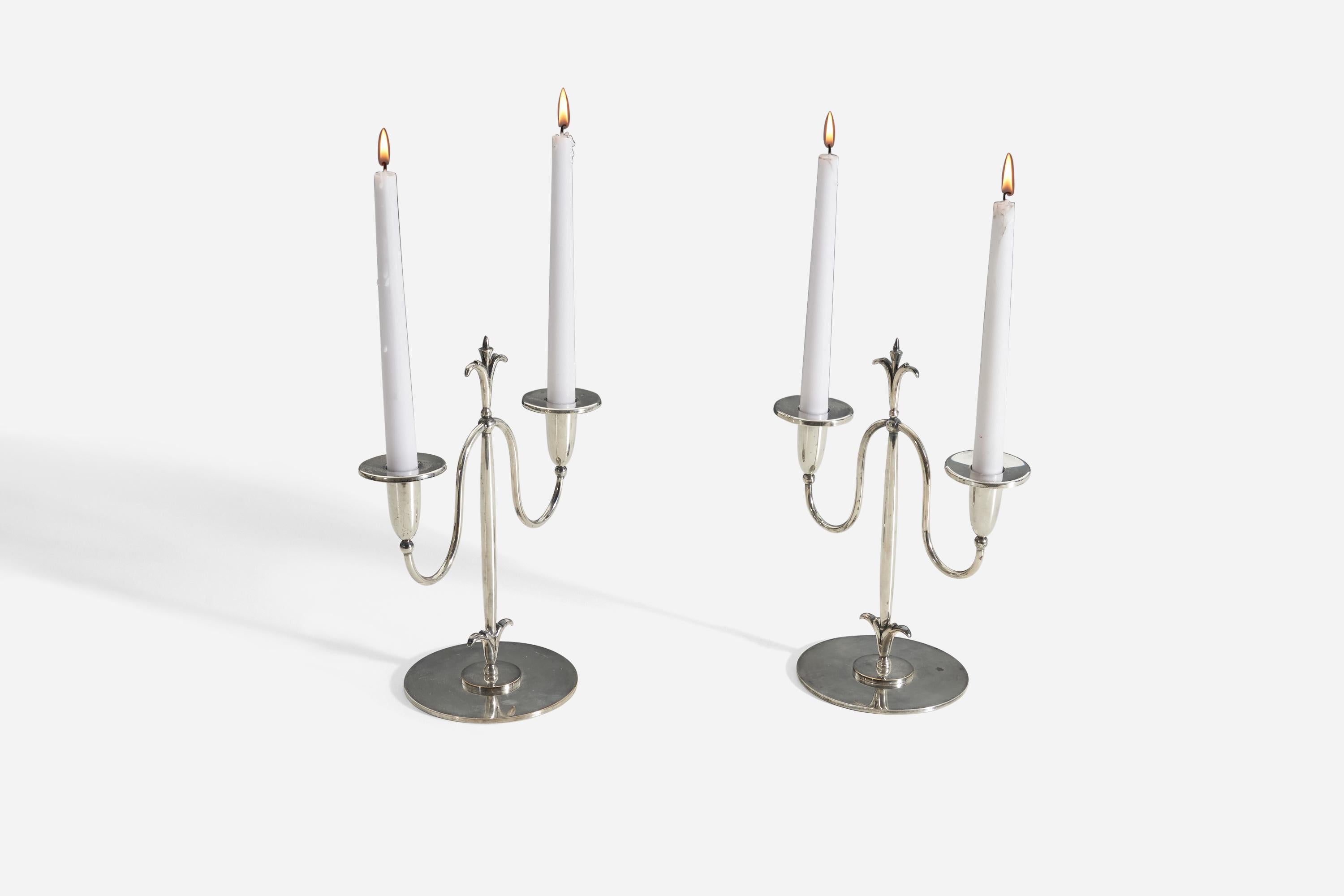 A pair of sterling silver candelabras designed and produced by C.G. Hallberg, Sweden in 1930s. Marked on bottom of the pieces. 

 