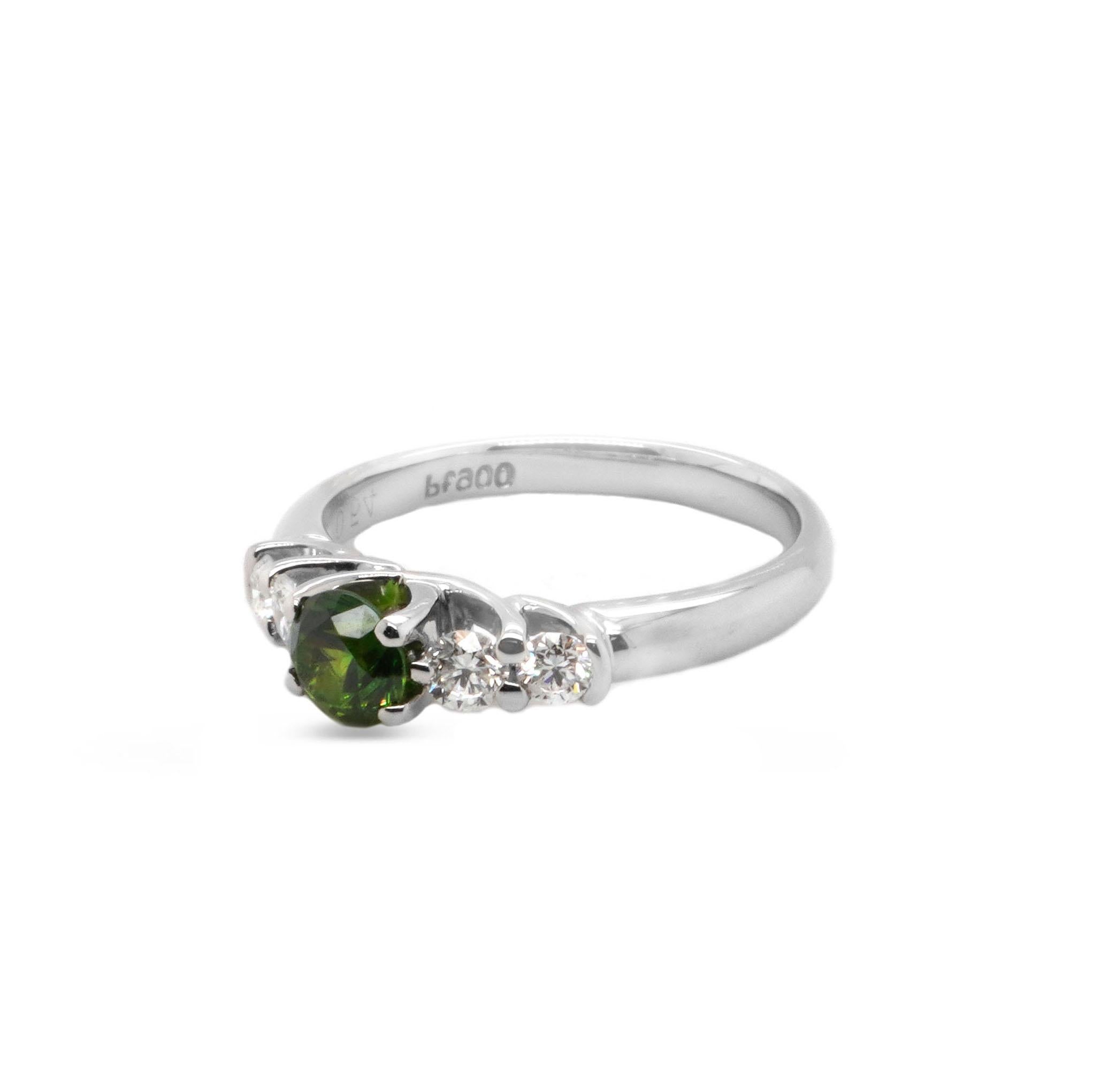 One of the rarest garnet varieties, Demantoid can have a green color that rivals emerald and a fire that exceeds diamond. Demantoids are highly prized by both gem collectors and jewelry enthusiasts. This solitaire ring consists of 0.54 carat CGL