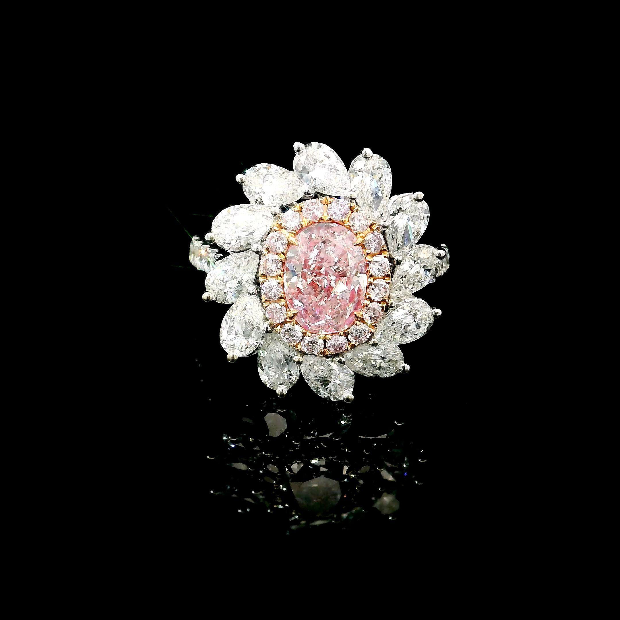 18kt white gold ring with diamonds
  
  Gold colour & karat: White gold 18kt
  Weight: 5.229 grams
  
  Set with-
  Stone type: Diamonds
  Shape: Oval
  Carat: 1.249
  Colour: Faint Pink  
  Clarity: SI2
  
  Surrounding Stones: Diamonds
 1) White