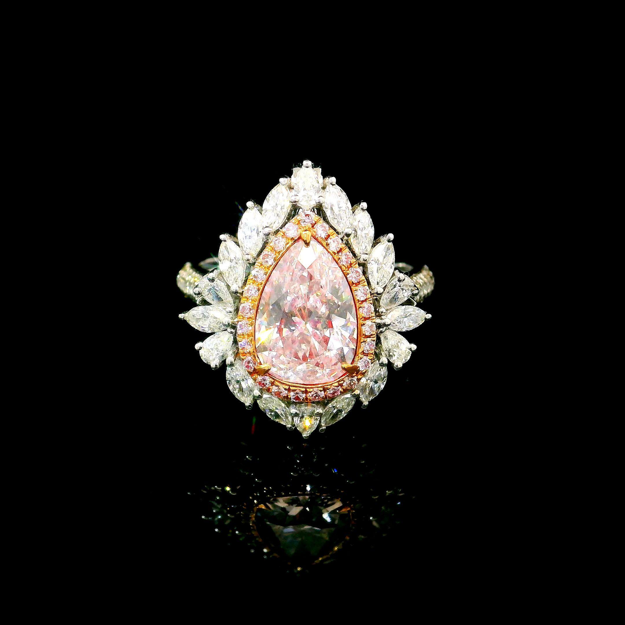 18kt white gold ring with diamonds
  
  Gold colour & karat: White gold 18kt
  Weight: 7.26 grams
  
  Set with-
  Stone type: Diamonds
  Shape: Pear
  Carat: 2.04 ct
  Colour: Very Light Pink
  Clarity: I1
  
  Surrounding Stones: Diamonds
 1)