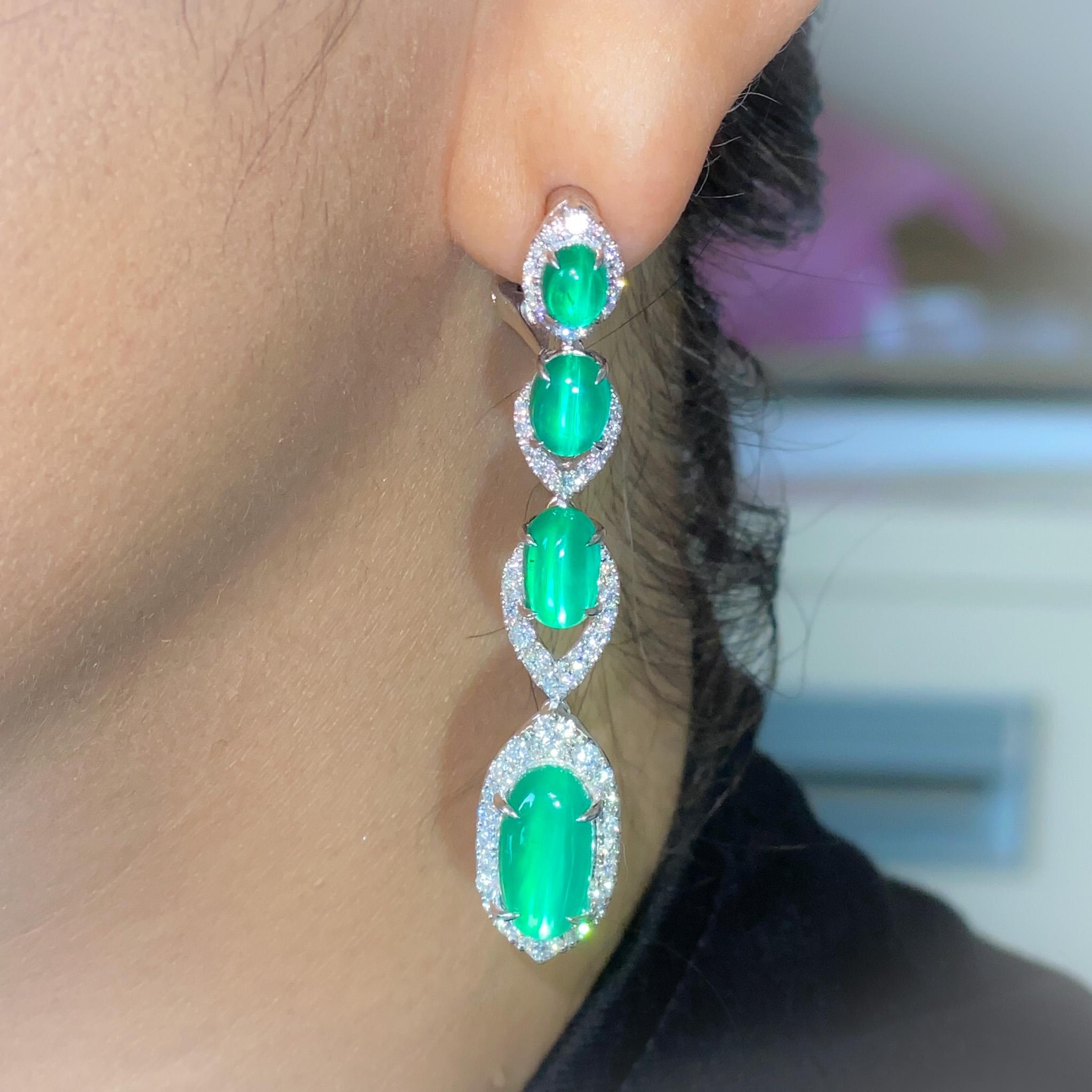This beautiful, Cat's eye emeralds are an extremely rare occurrence in nature and are sought after by collectors for their uniqueness.
CGL Certified 5.969 & 5.745 ct Emerald Cat's Eye earrings with 1.74/1.74ct diamond around them.