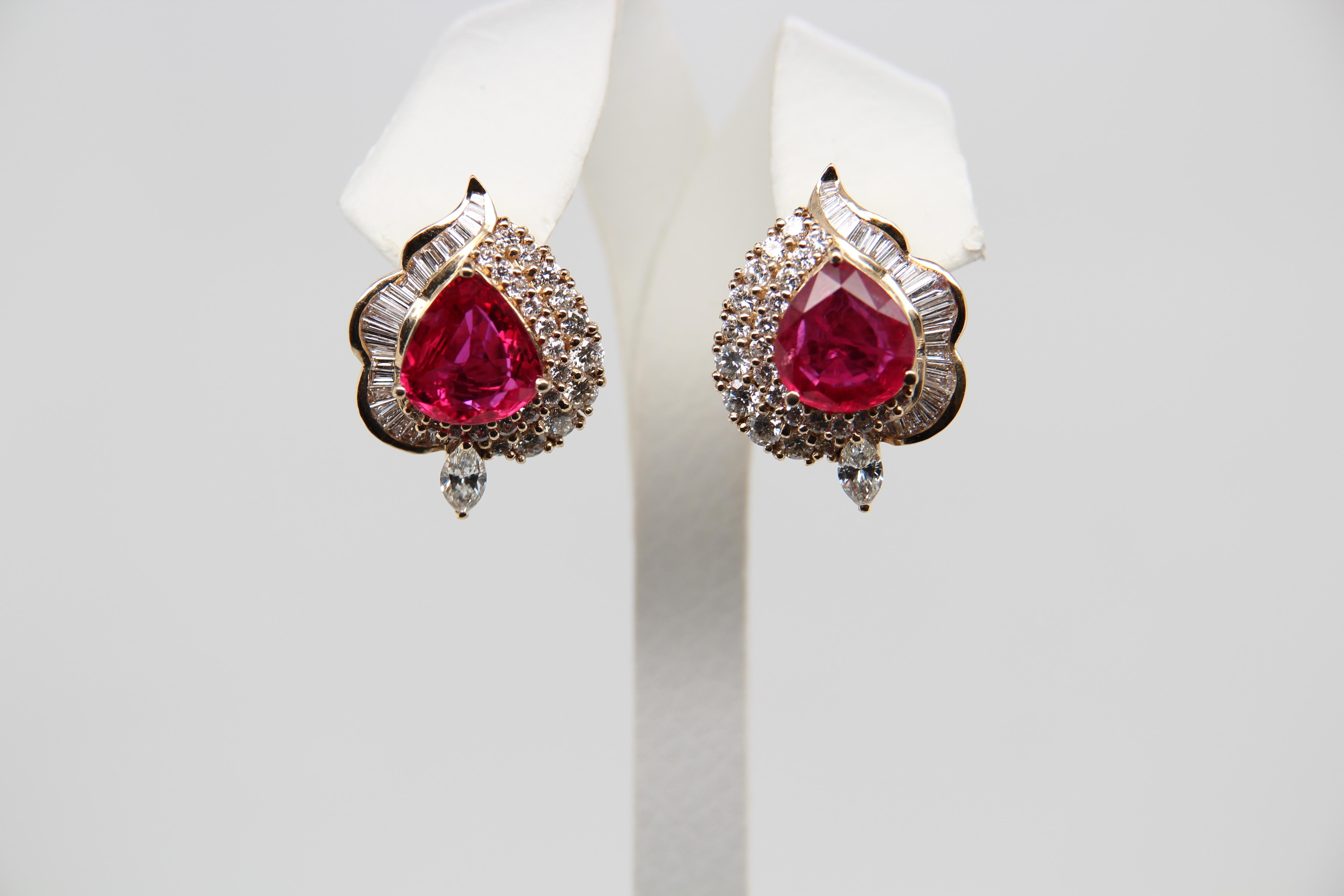 A ruby and diamond earring. The rubies are Thai weighing 3.47 and 3.57 Carat individually as certified by Carat Gem Lab (CGL) surrounded by 2.61 Carat diamonds. The earring is made in 18k white gold gross weight 17.44 g.