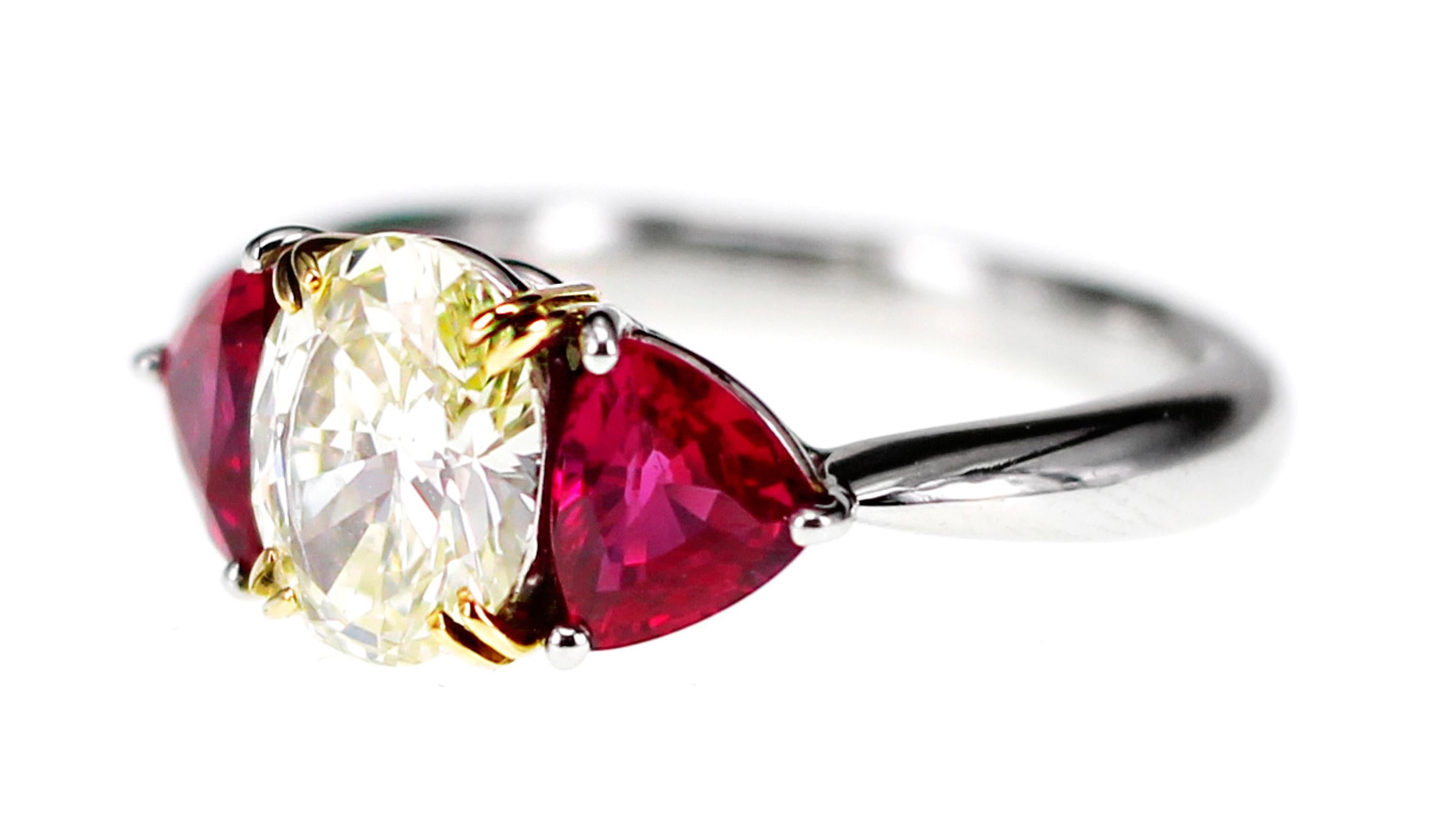 A 1.38 carat CGL Lab certified M color VS 2 clarity is set along with Gem Research Japan Inc Lab Certified 1.53 carat vivid red ruby. The ring is a perfect match of diamonds and ruby for a perfect bridal wear. The ring i made in PT 900 Platinum
The