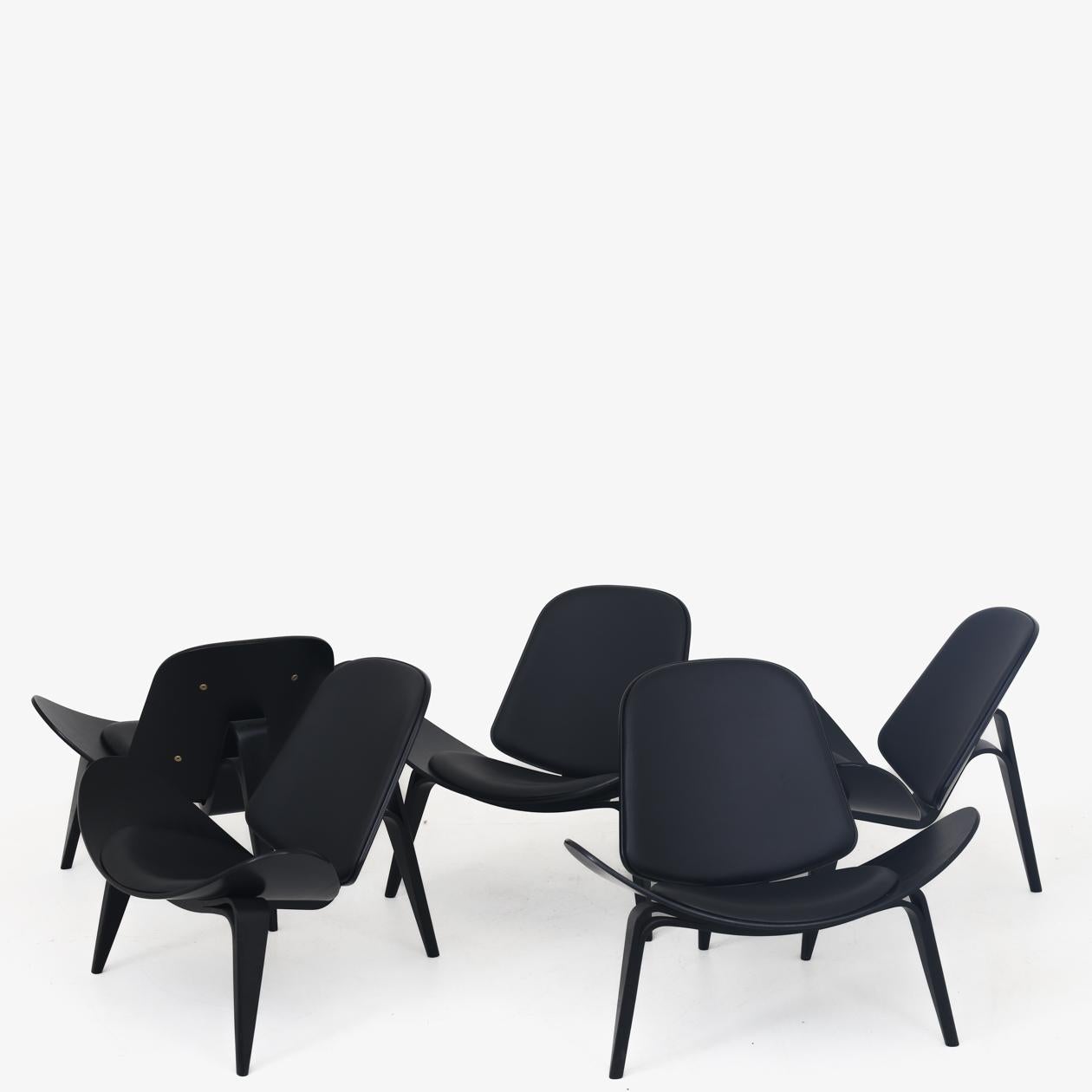 CH 07 - Shell chair in moulded, black glazed ash and black leather. Designed in 1963. 5 in stock. Hans J. Wegner / Carl Hansen.
