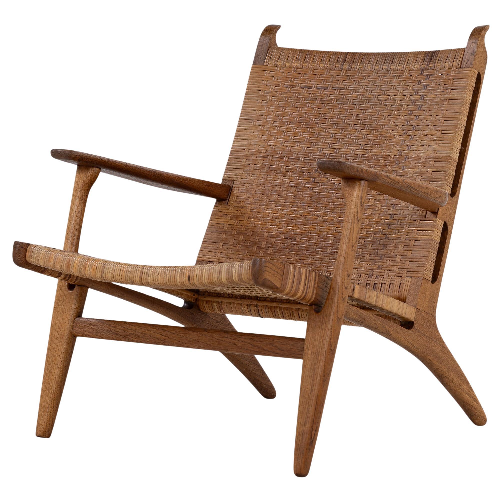 CH 27 - Lounge chair in patinated oak by Hans J. Wegner en venta