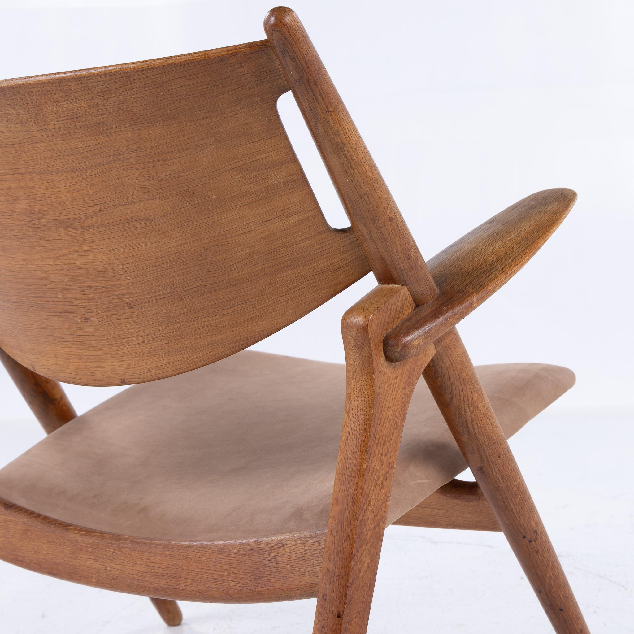 CH 28 - 'Sawbuck chair' in patinated oak by Hans J. Wegner For Sale 1