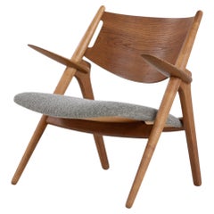 CH 28 - 'Sawbuck' easy chair in oak by Hans J. Wegner