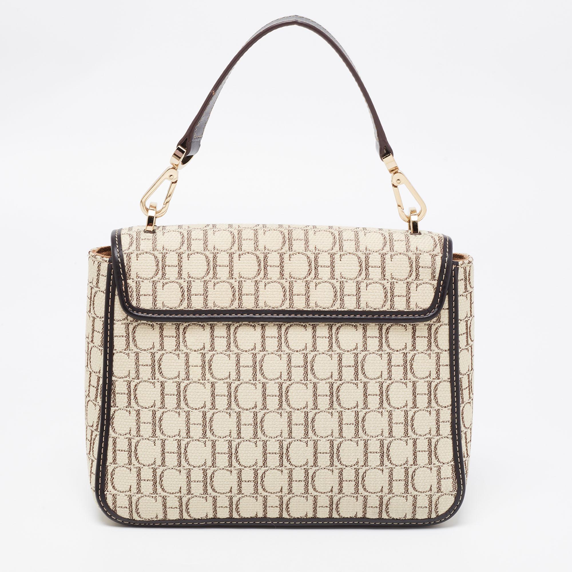 Bags from CH Carolina Herrera are ideal companions for ample occasions! Here we have a fashion-meets-functionality piece crafted in Monogram canvas and leather. It is equipped with a well-sized interior and comfortable handles to carry your
