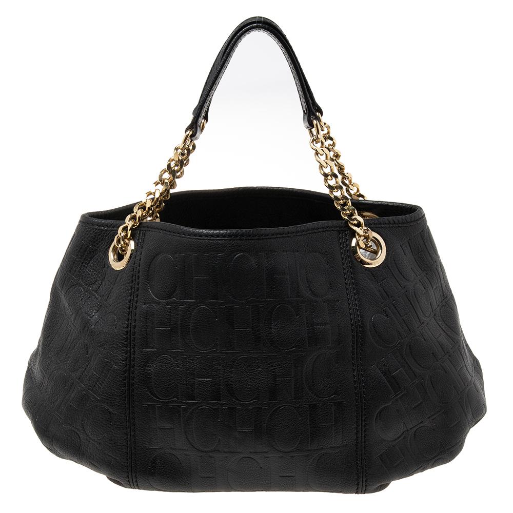 This classic black handbag by Carolina Herrera is pure style and charm. Crafted from the brand's signature monogram leather, its interior is lined with fabric and is well-sized to house your essentials. It features gold-tone hardware and will pair