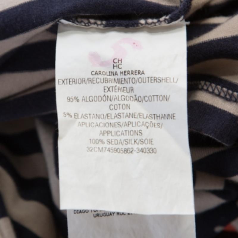 This CH Carolina Herrera top is the perfect example of modern designs blended with classic style. This magnificent blue and beige top with its trendy striped design and necktie are just too good for you. Sewn with a cotton blend, this top is an