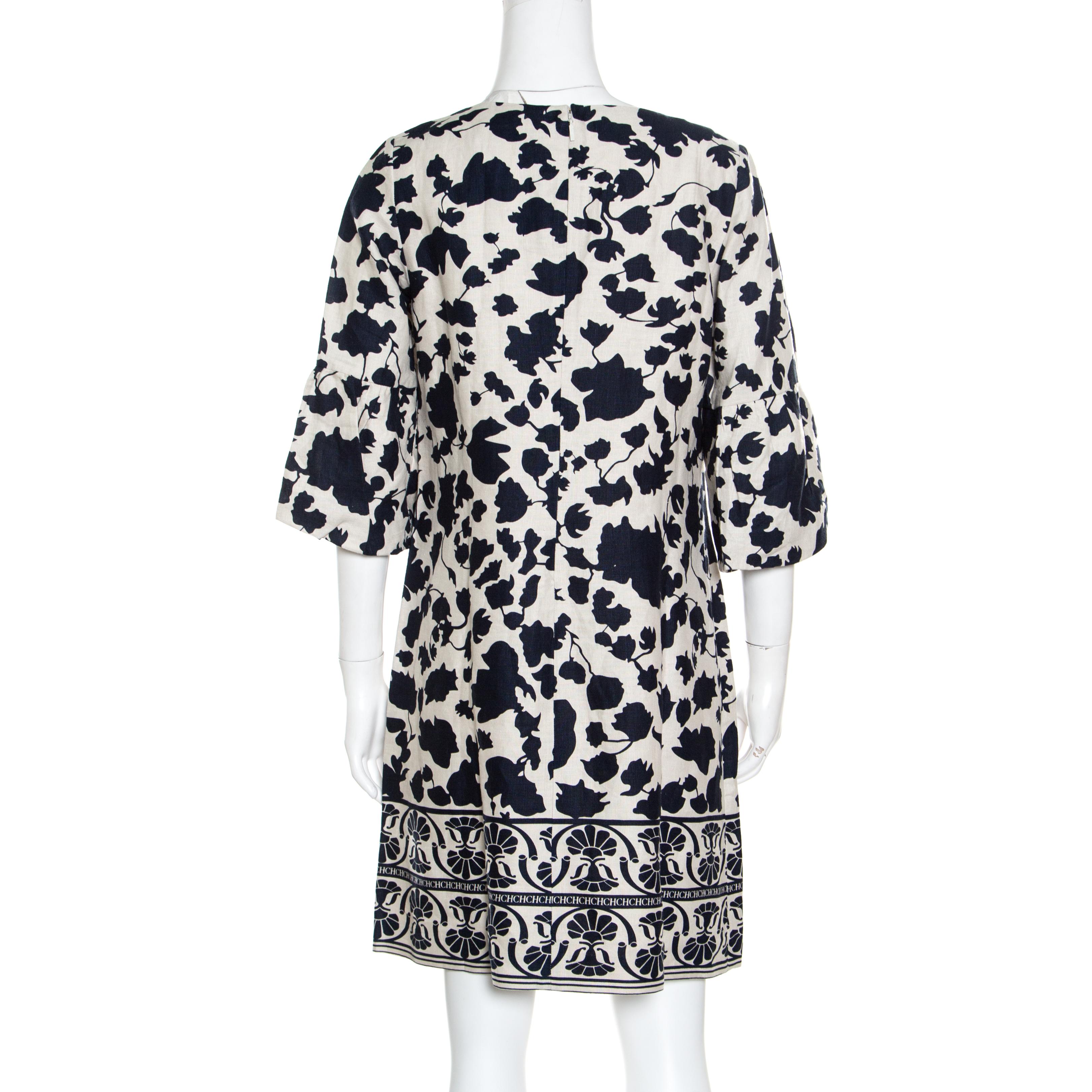 Adding a beautiful, chic touch to your casual daytime summer collection, this beautiful CH Carolina Herrera tunic dress is sure to become a summer staple. Constructed in blue and cream floral printed linen fabric, this dress features a simple round