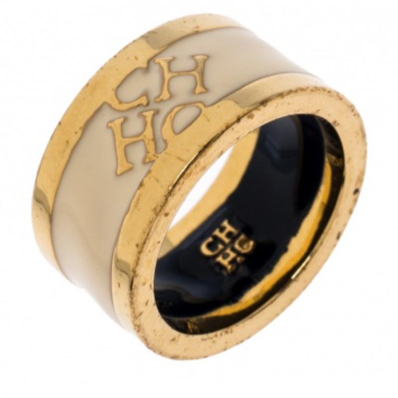 For the woman who is ready to ace every accessory game, Carolina Herrera brings her this fabulous ring made from gold-tone metal. The piece has a rather modern style with lovely enamel coating and CH detailed on it. This is one creation you'll love