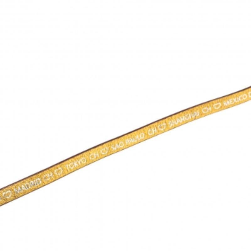 This CH Carolina Herrera gold triple wrap bracelet epitomizes the label's classic sophistication. Crafted from leather, this accessory features a gold-tone pin buckle and prints over the surface.
