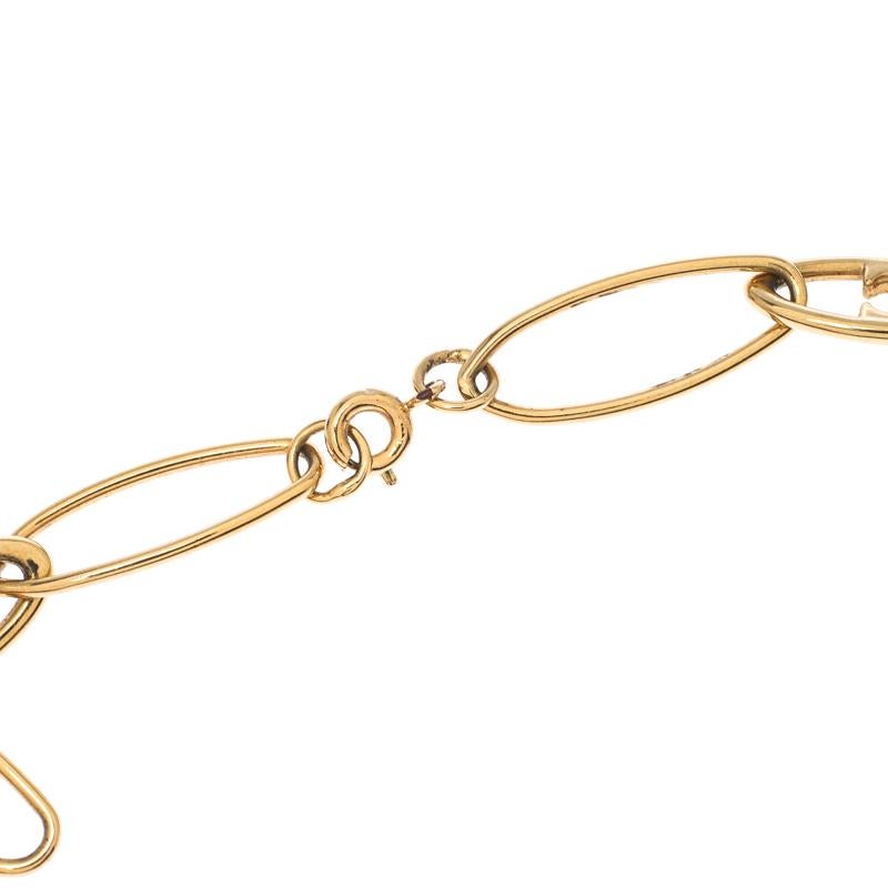 House of Carolina Herrera’s CH line brings this piece which is a great style for layering your neck-wear. This simple gold-tone chain holds the C and H inside the links of the chain. Wear this with your office attire or casuals. Use it on its own or
