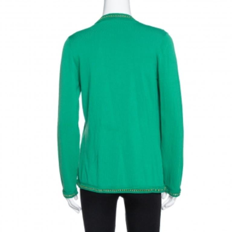 This green knit cardigan from the house of CH Carolina Herrera is simple yet stylish. It features metal detailing on the silhouette, long sleeves, and open front design. Wear it with your casual tops to ace a casual look.