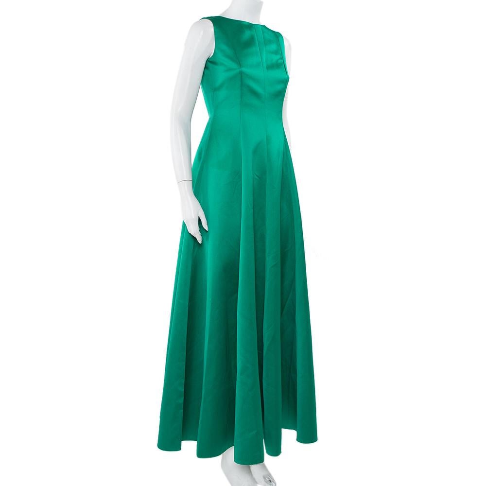 An example of elegant design, this amazing gown is from CH Carolina Herrera. An impressive green creation always comes in handy no matter what the occasion. Made from quality satin, this gown has an open back, a defined waist, and a flared skirt.

