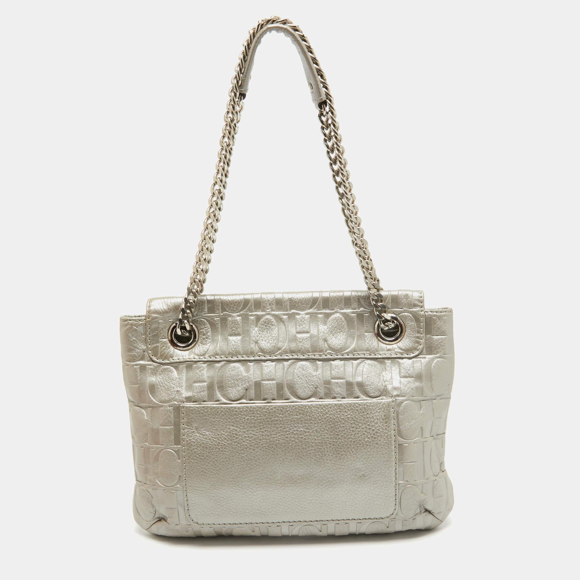 Structured, sophisticated, and stylish are some words that describe this shoulder bag! Crafted from the best quality material, the creation is adorned with the label's signature appeal and equipped with a well-spaced interior. Carry it to parties or