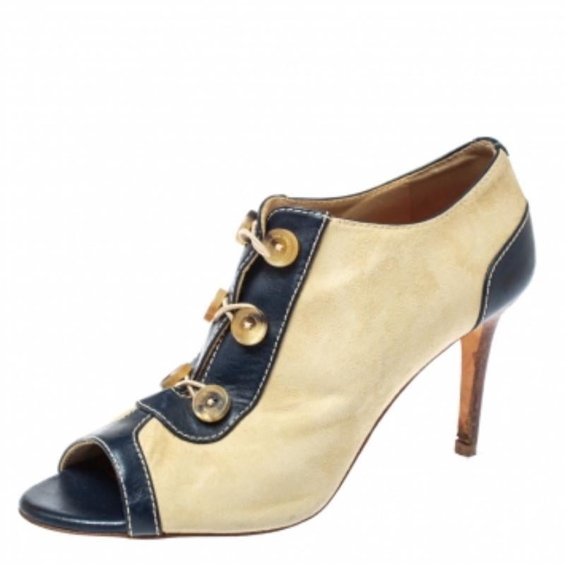 Let these suede and leather booties elevate your style this season. The classy pair from CH Carolina Herrera is detailed with buttons on the front and set atop 8.5 cm heels to take your style soaring. The booties are lined with leather.