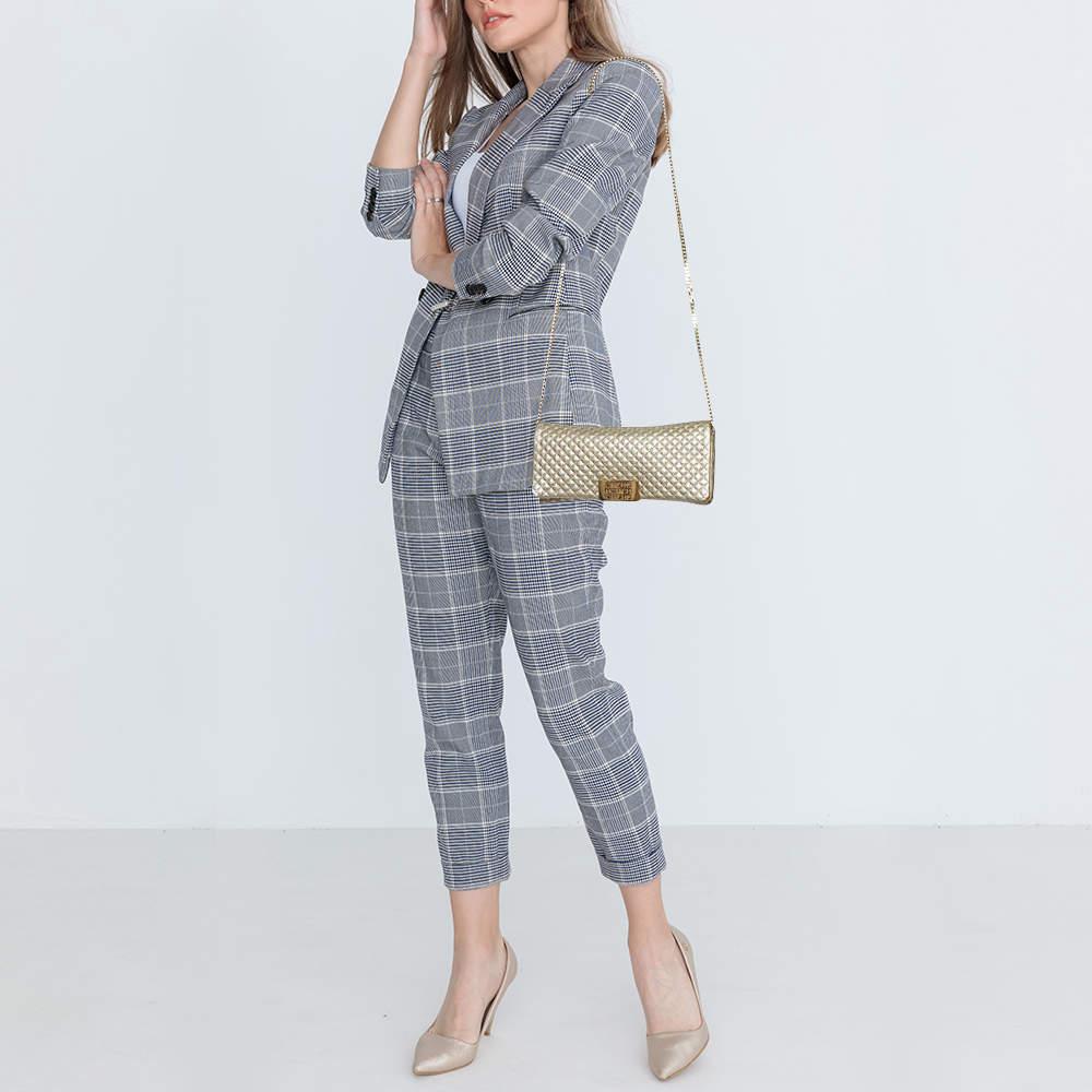 The clutch from CH Carolina Herrera goes well with any outfit. This stunning metallic gold clutch is crafted from quilted leather and comes with a flap opening that opens to a neatly lined interior and a chainlink strap.