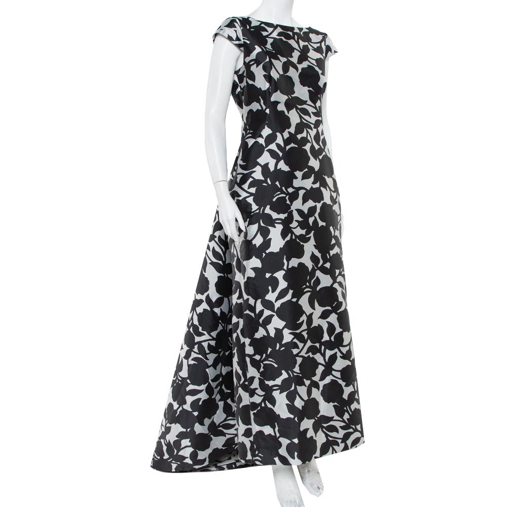 Mit diesem CH Carolina Herrera-Kleid können Sie Ihre Schönheit mühelos zum Ausdruck bringen. Es wurde aus hochwertigen Materialien gefertigt und mit monochromen Prints und einem frei fallenden Saum gestaltet. Das Kleid ist ärmellos und hat einen