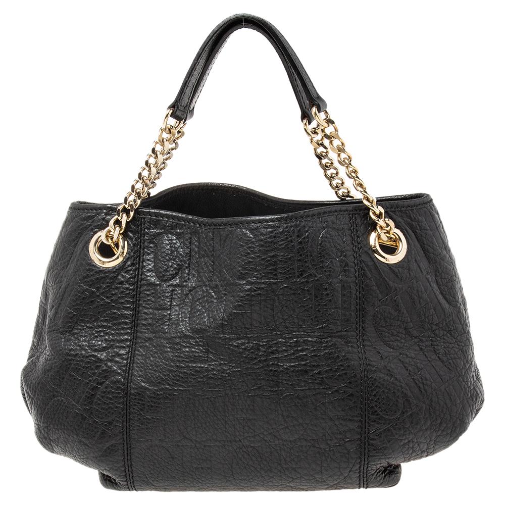 This Carolina Herrera Hobo is sure to impress. Elevated with monogram canvas, it features chain arm-held straps, gold-tone hardware and is covered in leather. Its spacious interior, lined with nylon, has enough space to be your work or shopping