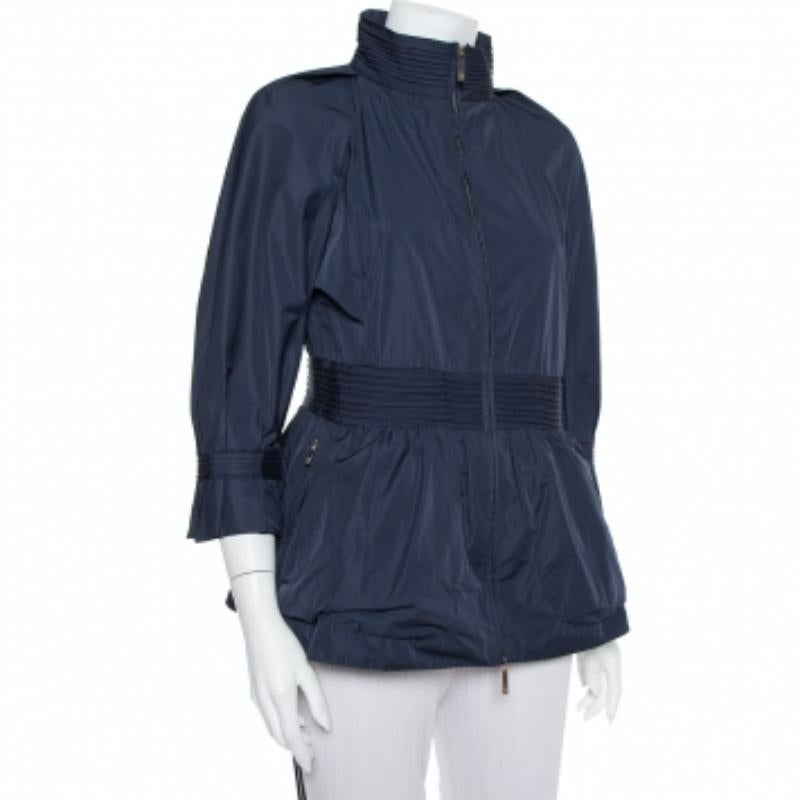 CH Carolina Herrera jacket promises style, style, and comfort. Made from a blend of quality materials in a navy blue shade, the jacket has peplum detailing and a front zip fastening. Style the creation with fitted leggings for a stylish look.