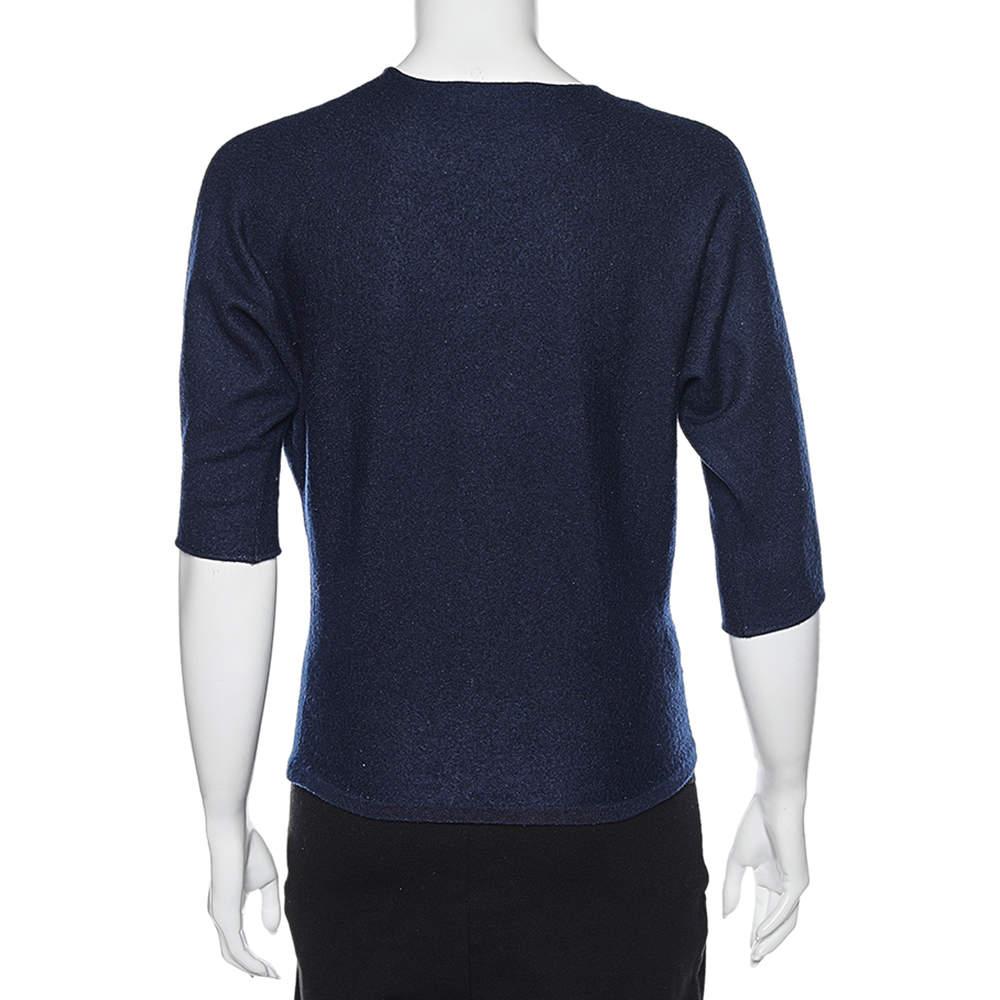 Your search for a simple, chic, and sophisticated jumper ends with this lovely one from CH Carolina Herrera. This navy blue jumper has a round neckline with three-quarter sleeves and lace trims. The splendid creation can be paired with a lot of