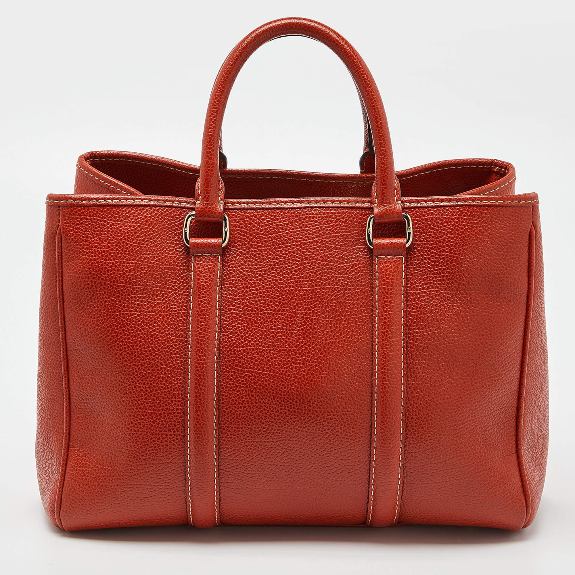 This alluring tote bag for women has been designed to assist you on any day. Convenient to carry and fashionably designed, the tote is cut with skill and sewn into a great shape. It is well-equipped to be a reliable accessory.

Includes: Original