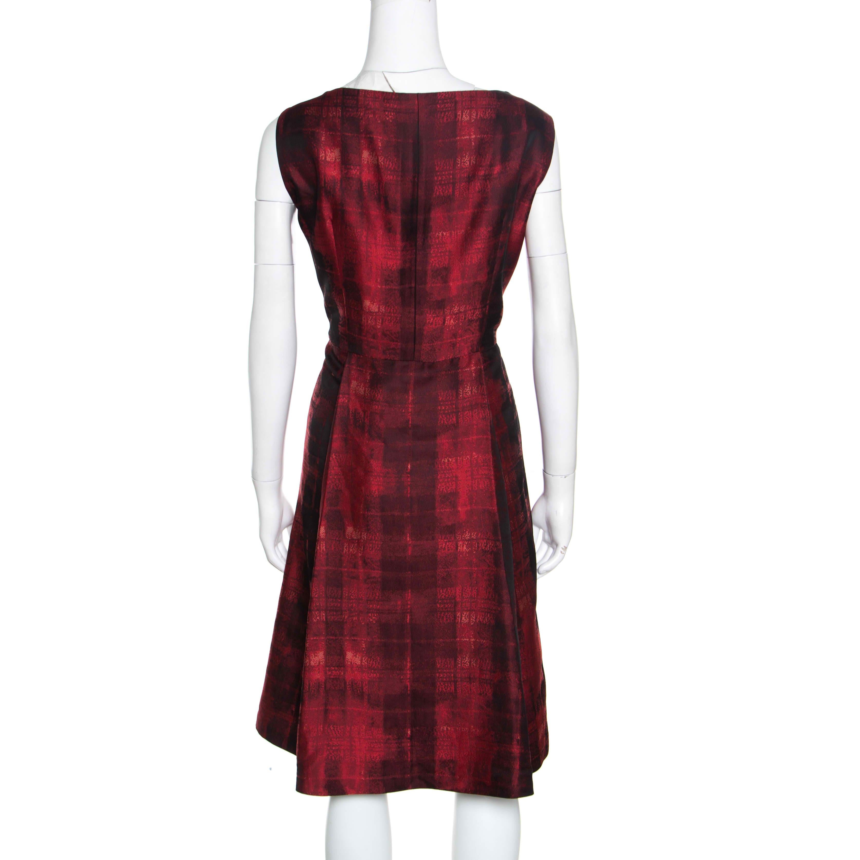 Ditch those mundane dresses and go for a glam, statement-making style with this CH Carolina Herrera dress. This red and black dress with abstract patterns is the best way to stand out in a world full of generics. Flawlessly designed from blended