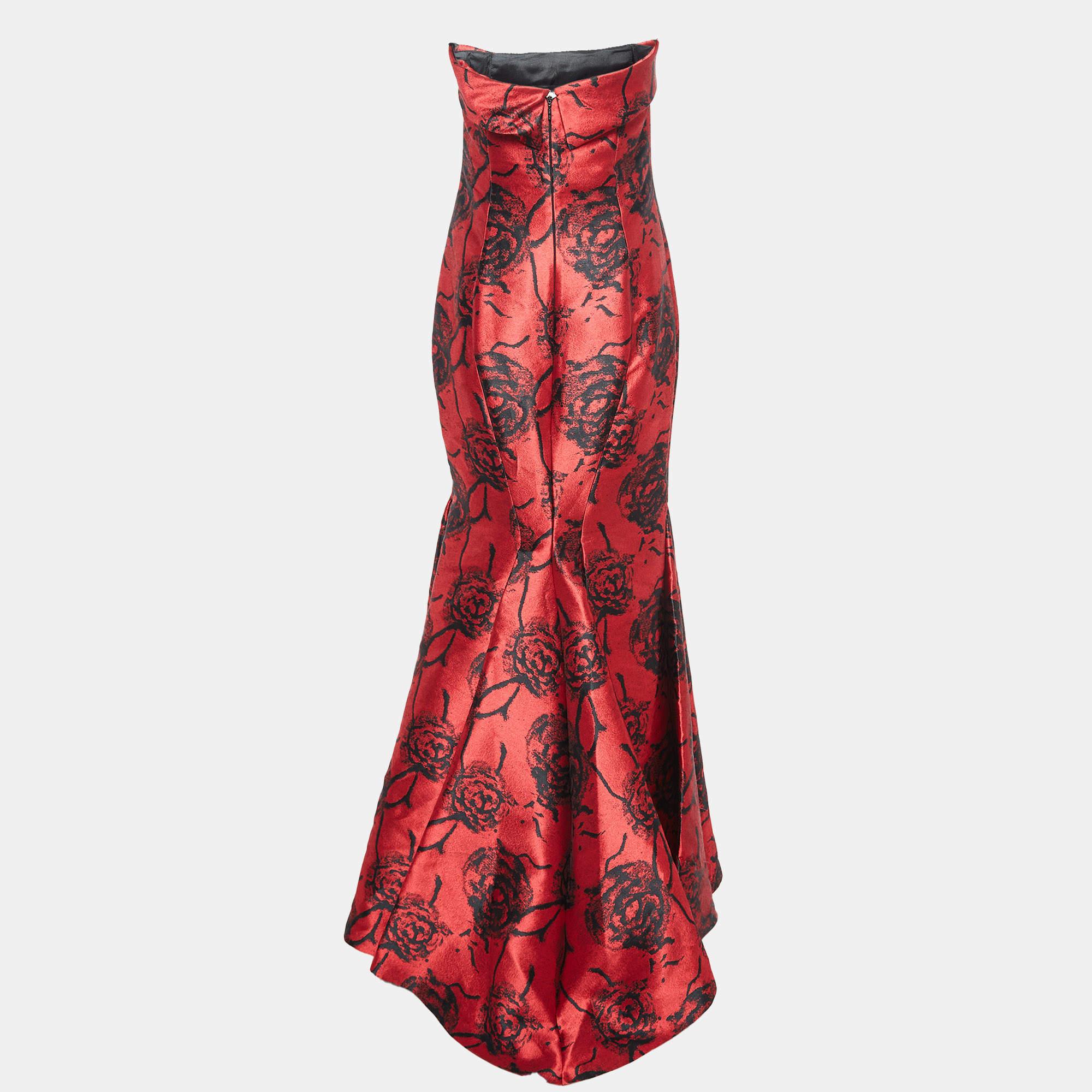 Another marvel from CH Carolina Herrera thats too pretty for words is this gown in red and black. The jacquard gown flaunts a feminine strapless design floral embroidery and flared skirt.