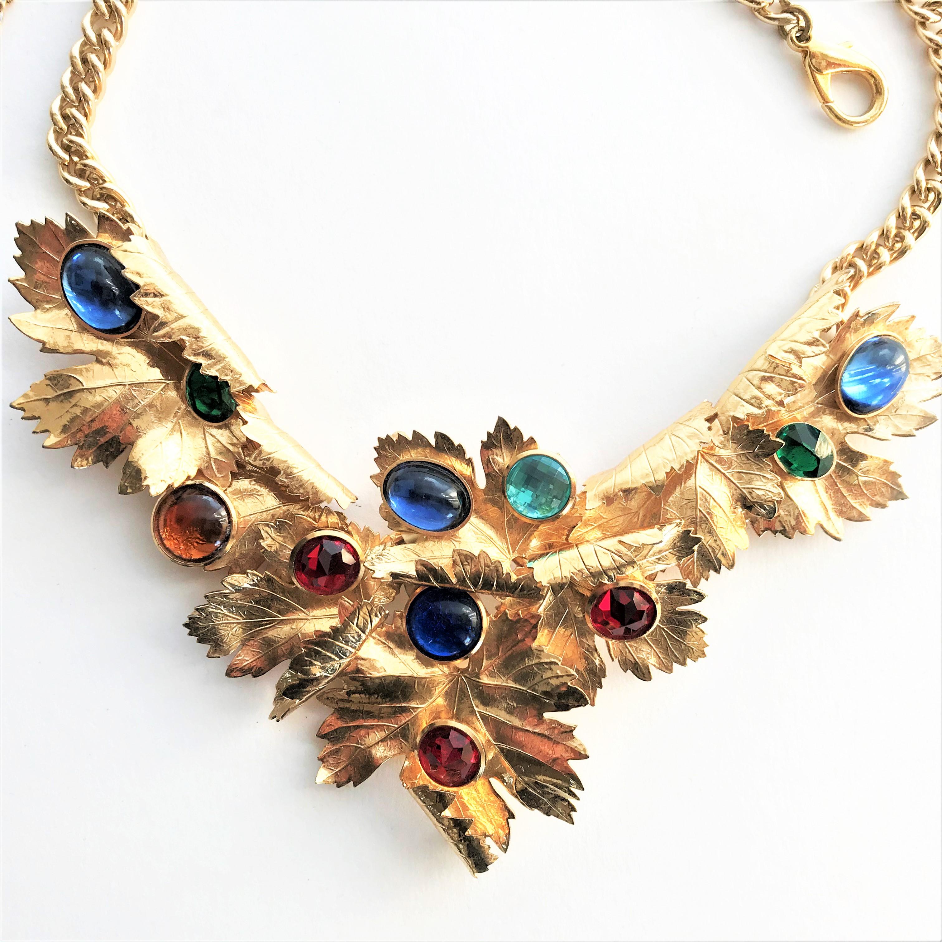 Very interesting, beautiful Christian Dior necklace consisting of 7 maple leaves, each set with a set of rhinestones. Some of the stones are cut or round. Each leaf is rolled up on one side and the leaf veins are nicely v
Very interesting, beautiful