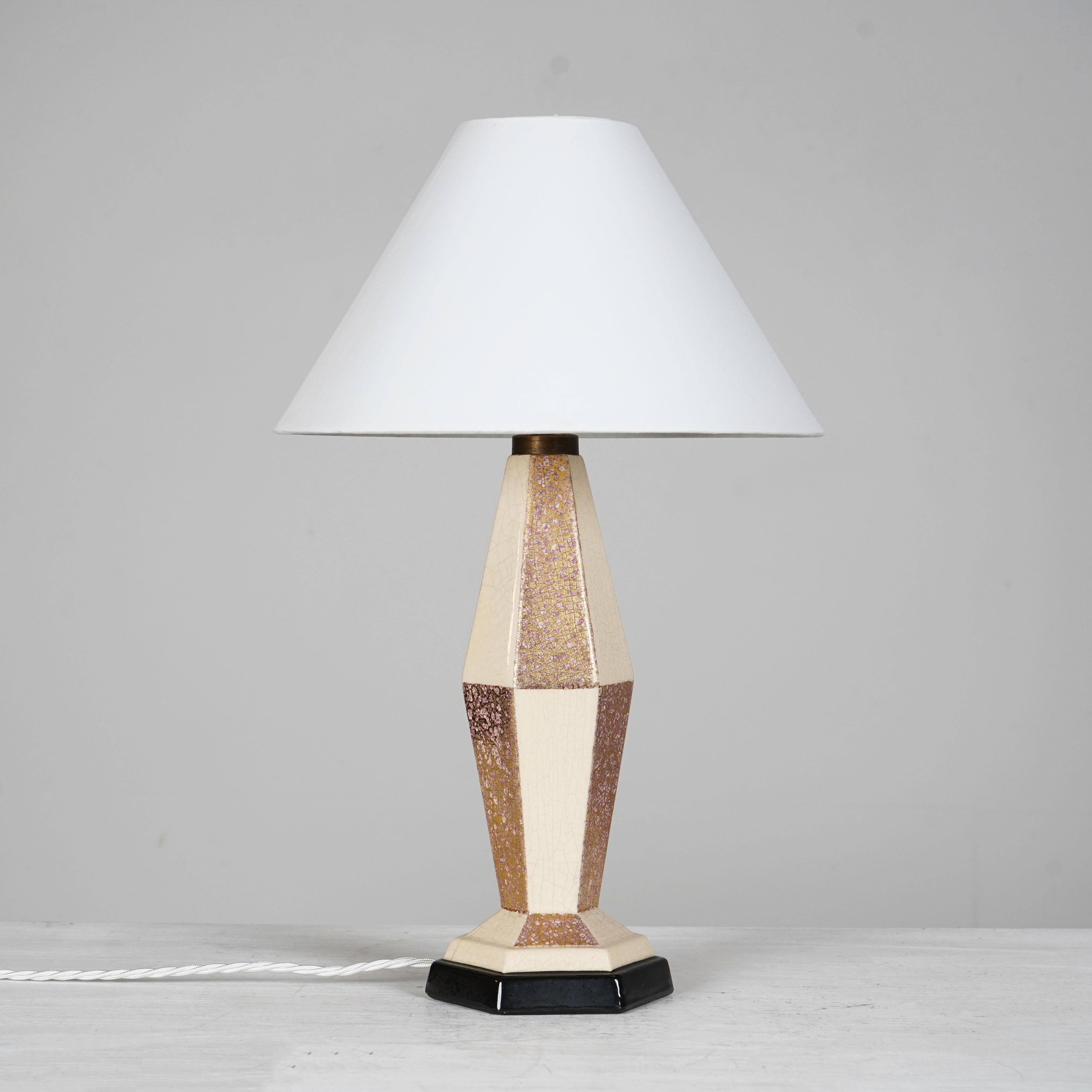 French ceramic lamp signed C.H France. 
Art Deco lamp designed by Charles Harva. 
Good condition, re-wired and PAT tested. bayonet bulb and 3 uk plug 
Shade not included.
 
Dimensions
 
H 35cm (to the top of light fitting), W 13cm D 11.5cm
 
About