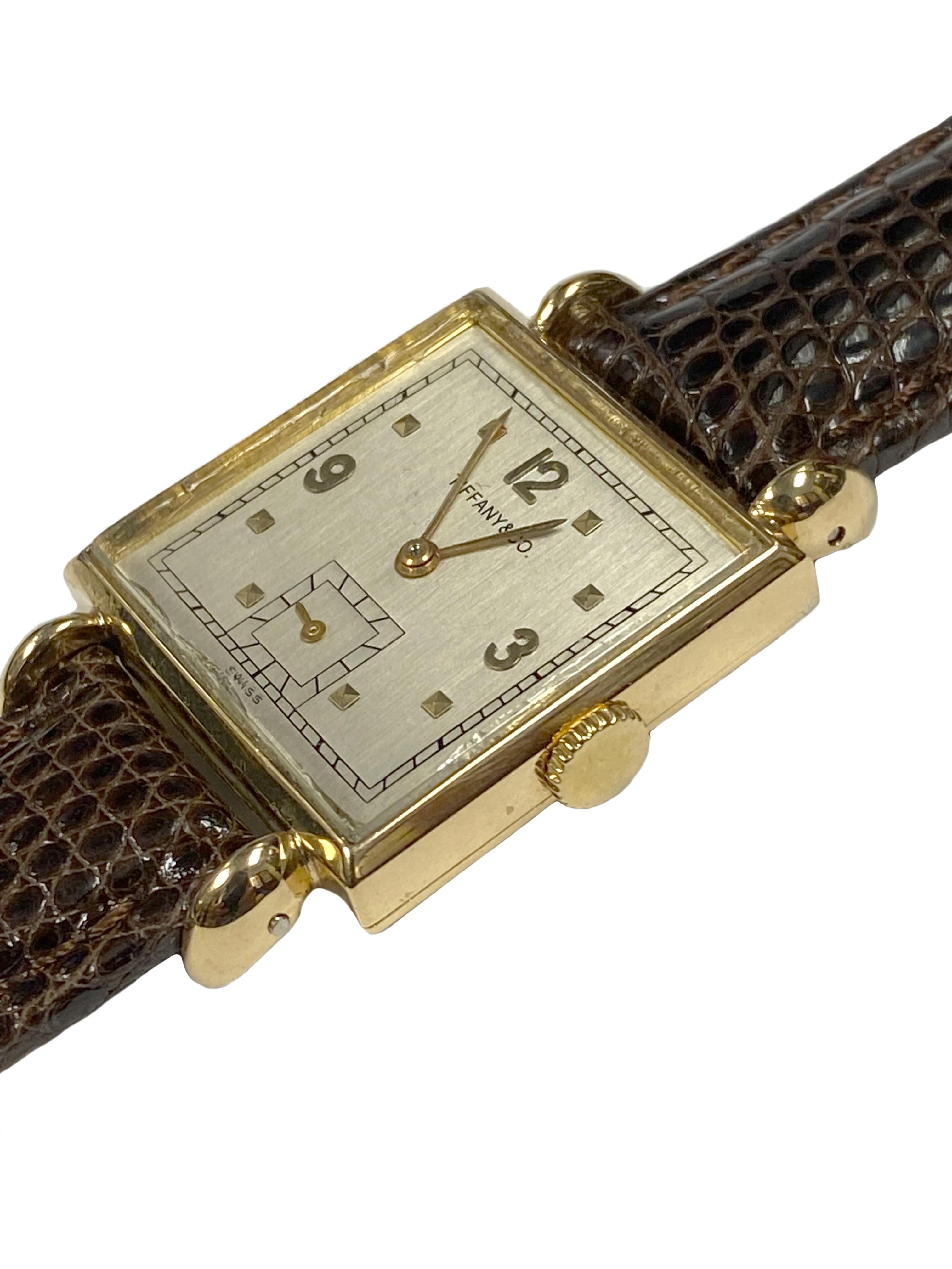 Circa 1930s C.H. Meylan for Tiffany & Company Wrist Watch, 26 X 26 M.M. Square 2 piece 18K yellow Gold Case with tear drop lugs. 17 Jewel C.H. Meylan Movement, Silver Satin dial with raised Gold markers. New Brown Padded, Stitched. Lizard strap.