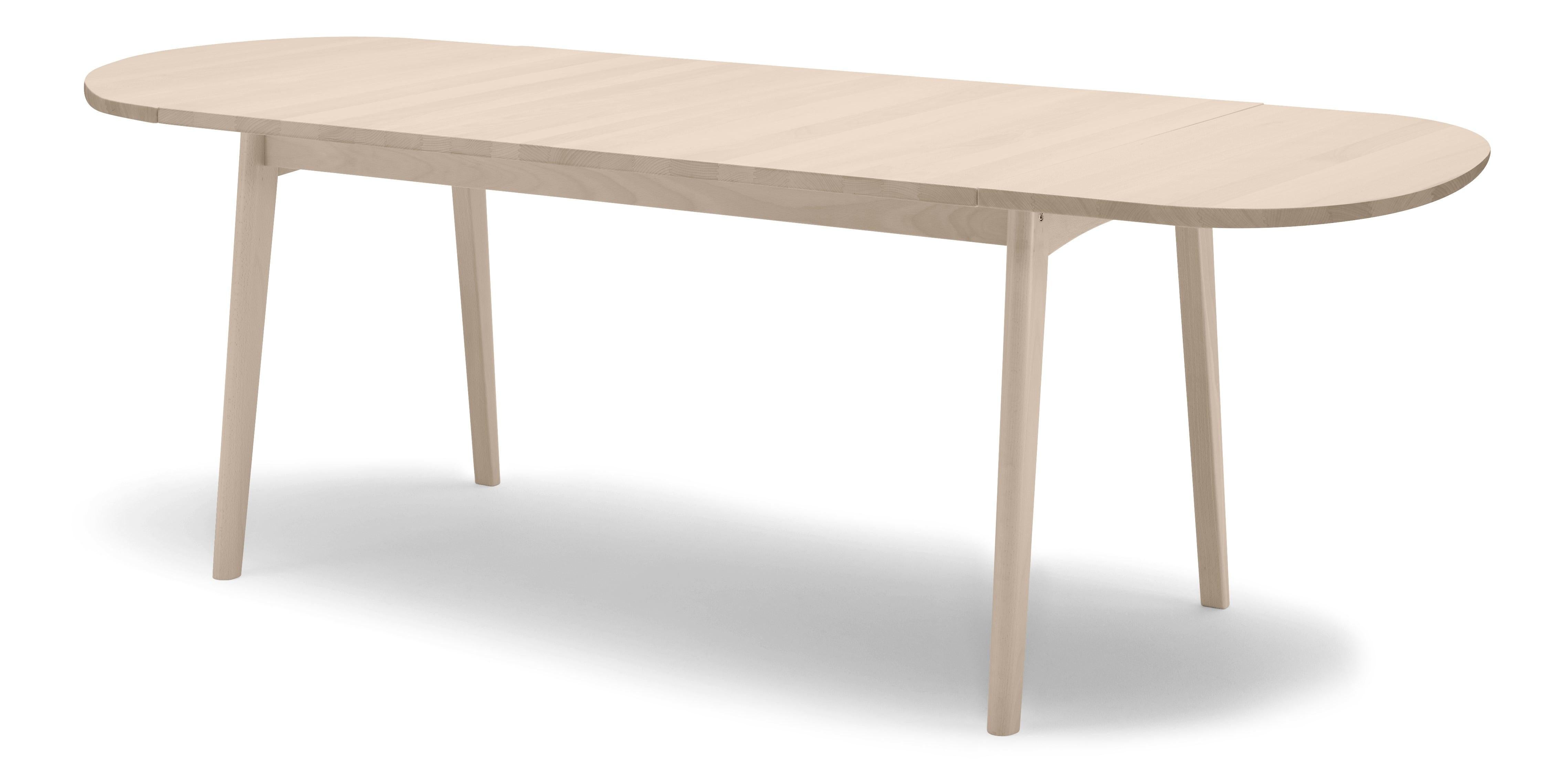 The CH006 dining table highlights Hans J. Wegner’s exceptional attention to detail and focus on functionality. The CH006 is ideal for smaller as well as more spacious settings with its clean, intelligent design. The table comes equipped with hinged