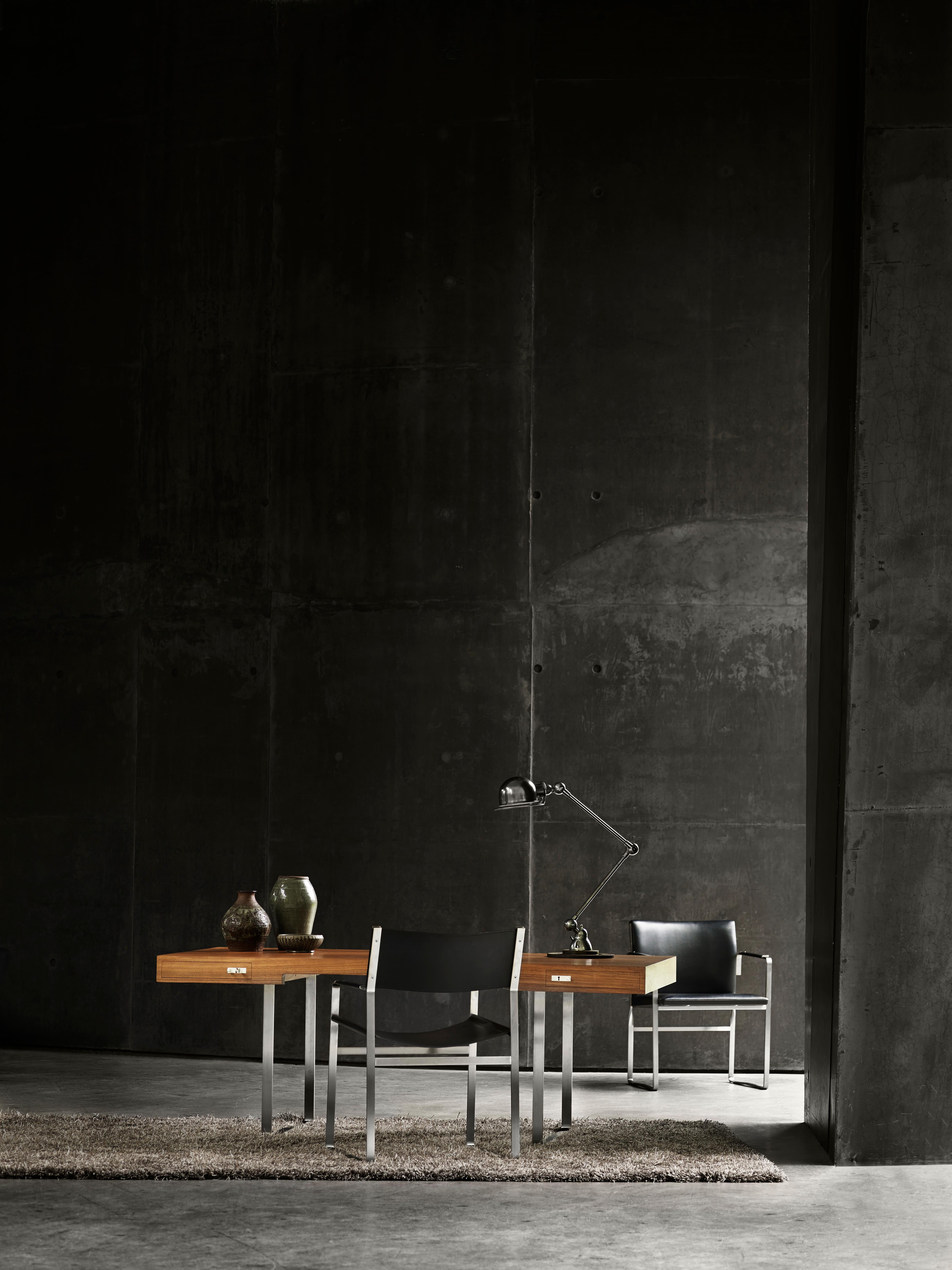 The CH111 chair designed by Hans J. Wegner is part of a series of significant furniture with a frame in flat stainless steel and seats and backs upholstered in leather. The chair’s subtle strength and clean and simple lines are the essence of