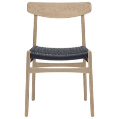 CH23 Dining Chair in Wood Finishes with Black Papercord Seat by Hans J. Wegner