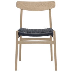 CH23 Dining Chair in Wood Finishes with Black Papercord Seat by Hans J. Wegner