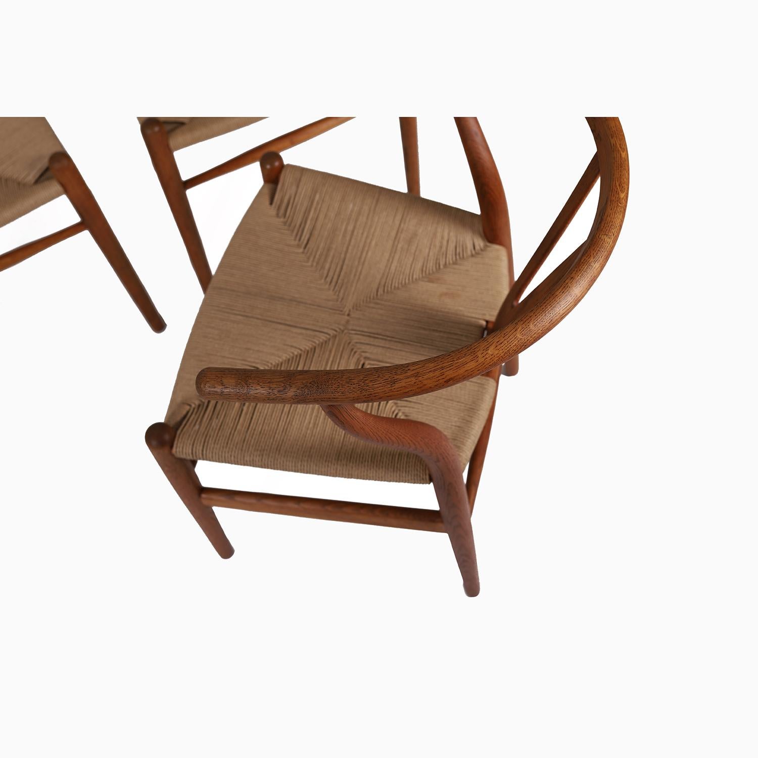 A beautiful vintage set of wishbone chairs, aka the Y chair, by Hans J. Wegner.  In patinated white oak with newly woven Danish papercord seats.  


Professional, skilled furniture restoration is an integral part of what we do every day. Our goal is